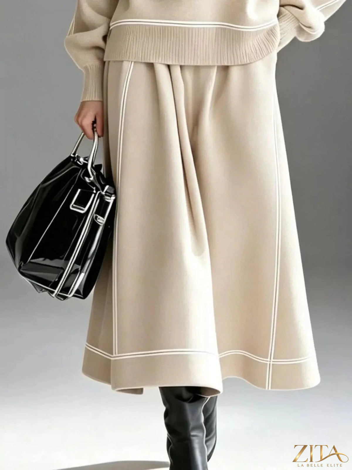 Zita La Belle Elite turtleneck knit top and midi skirt set, featuring a cozy turtleneck sweater and elegant midi skirt in soft fabric.