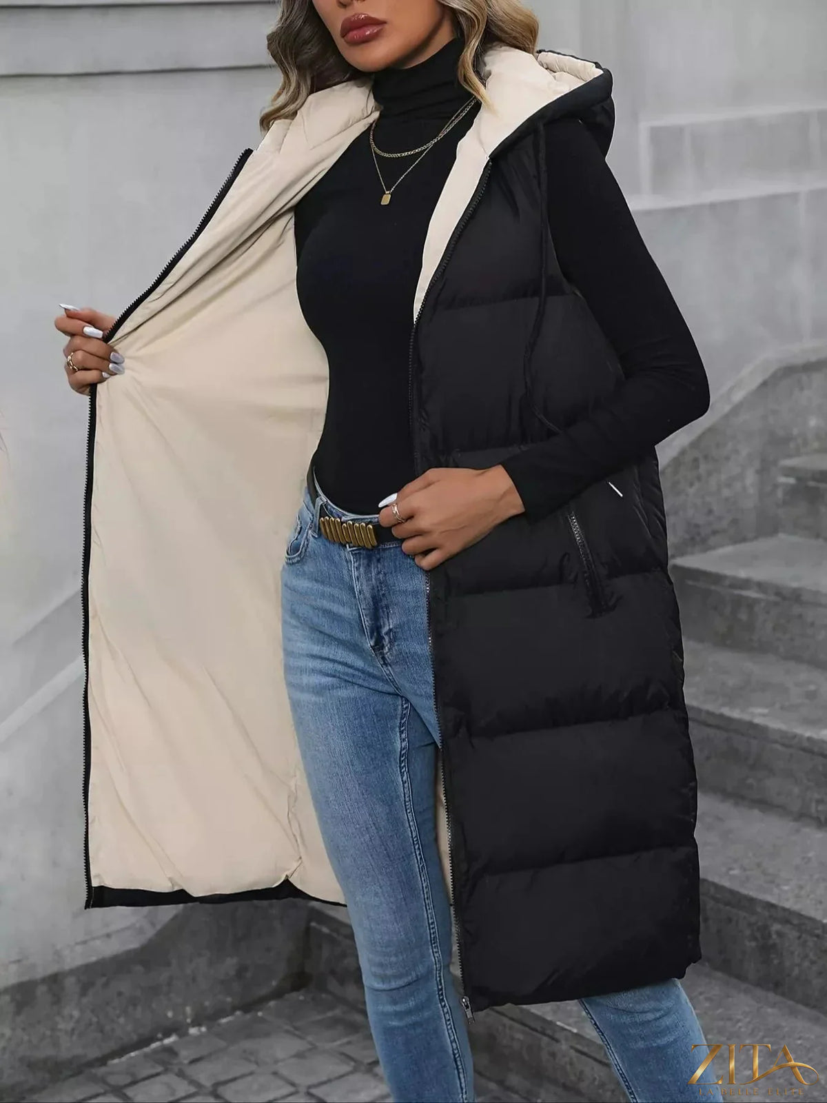 Zita La Belle Elite longline padded hooded vest coat with a sleek design and quilted padding, ideal for cold weather.
