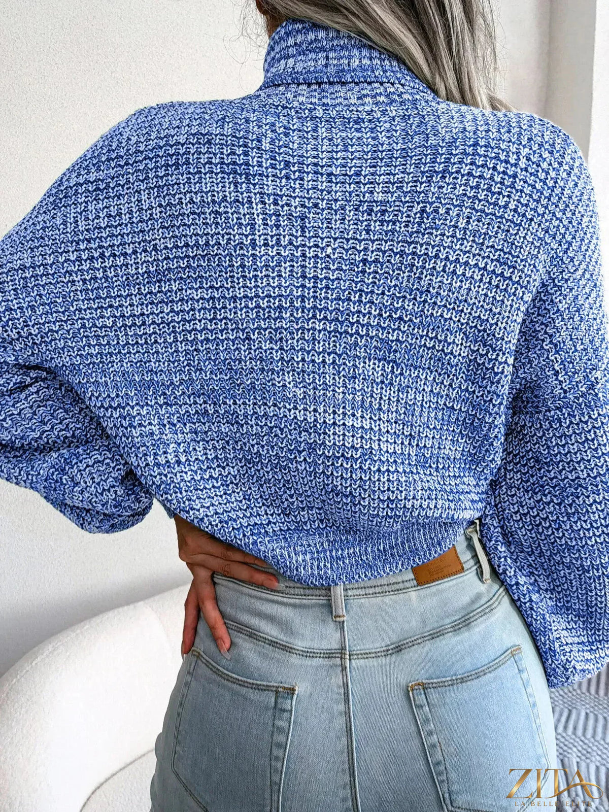 Cream turtleneck dropped shoulder sweater by Trendsi, featuring a cozy knit fabric and relaxed fit, styled on a model.