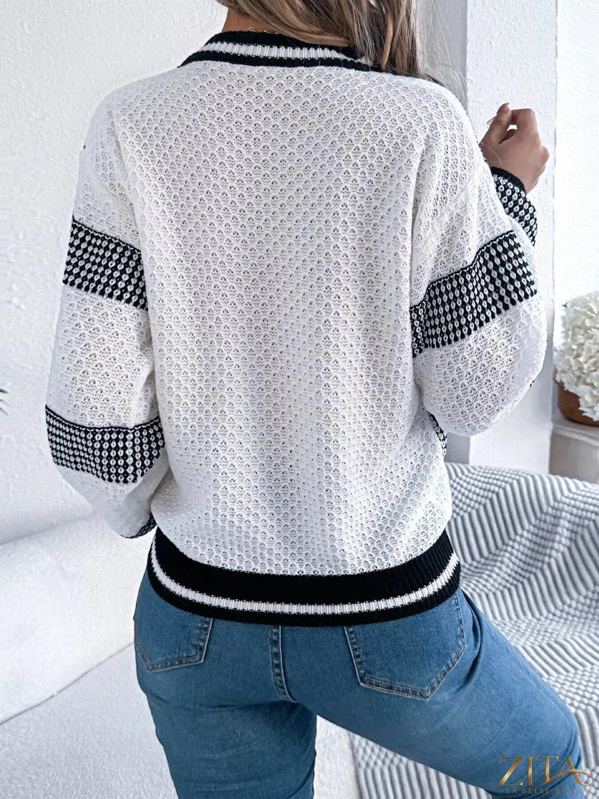 Contrast striped V-neck sweater by Trendsi featuring a stylish pattern and soft knit fabric in a flattering fit.