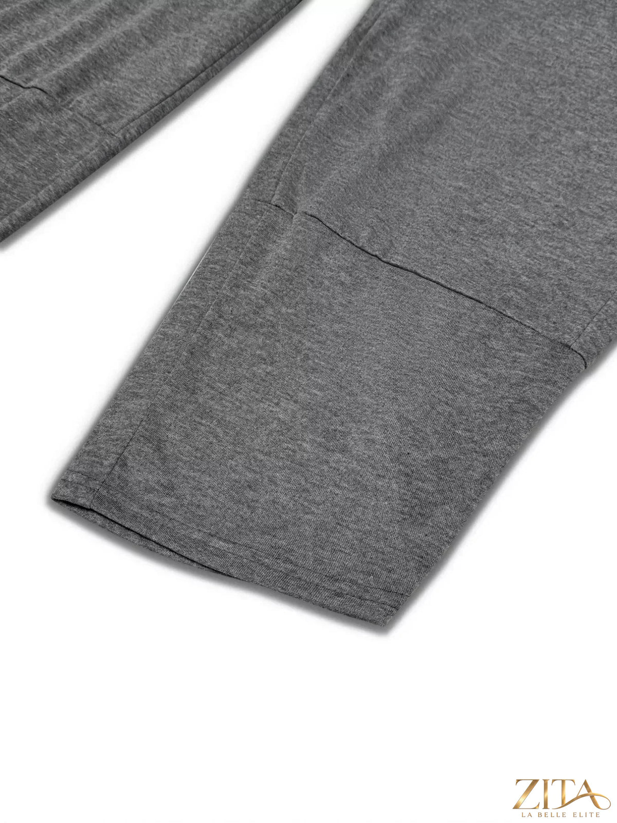 Plus size casual loose fit top and pants two-piece set from Trendsi, featuring comfortable, relaxed-fit fabric in neutral tones.