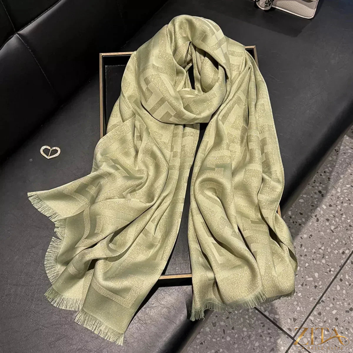 Raw hem scarf from Trendsi featuring soft, lightweight fabric and fringed edges, styled in neutral tones for versatile wear.