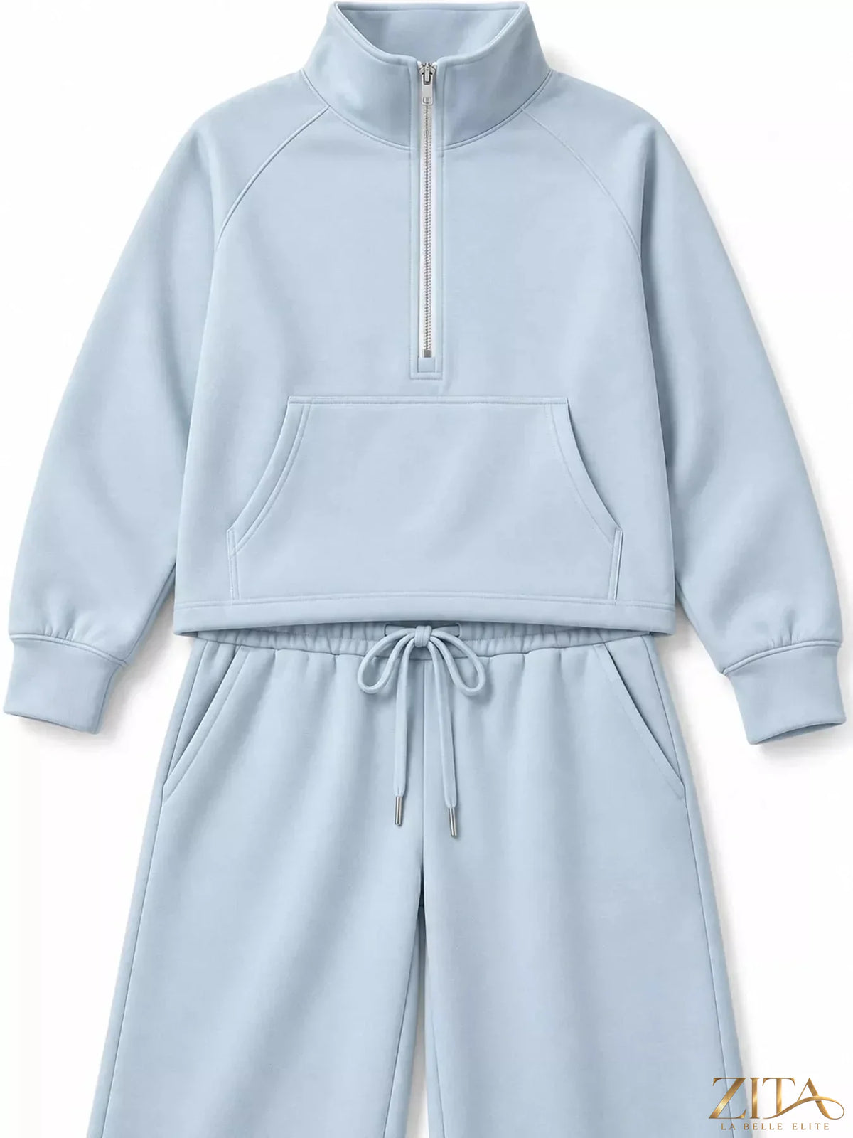 Zita La Belle Elite half-zip sweatshirt and wide-leg pants set, shown in a comfortable, casual indoor outfit with natural lighting.