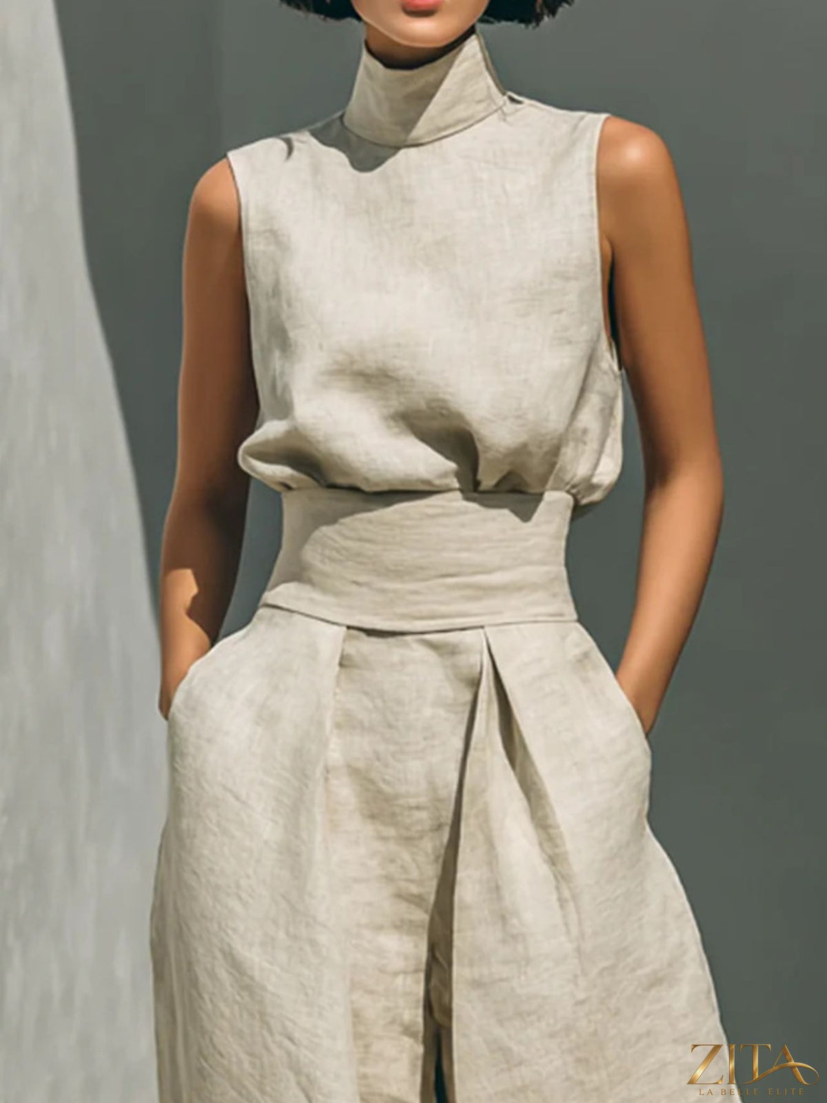 Zita La Belle Elite sleeveless turtleneck top and matching pants set in neutral fabric, displayed on a mannequin.