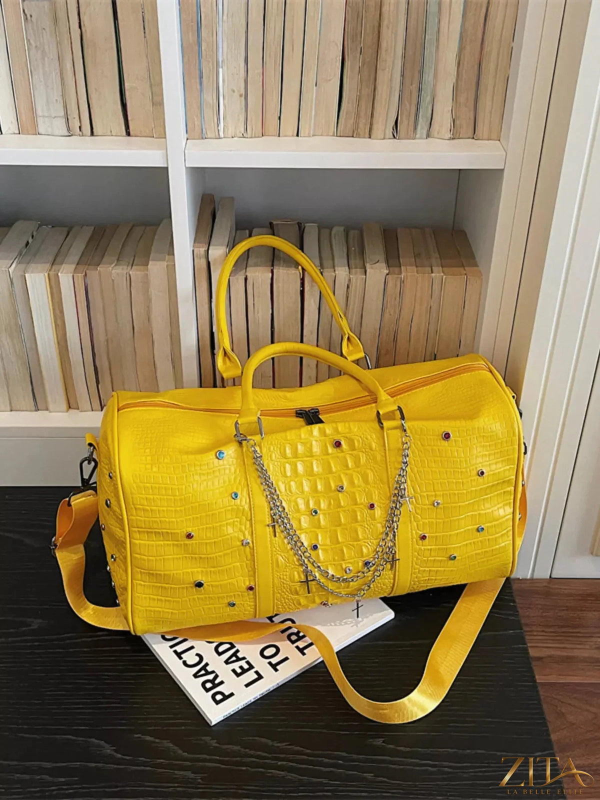 Black studded leather duffel bag by Trendsi with silver hardware and adjustable shoulder strap, showcasing its spacious interior.