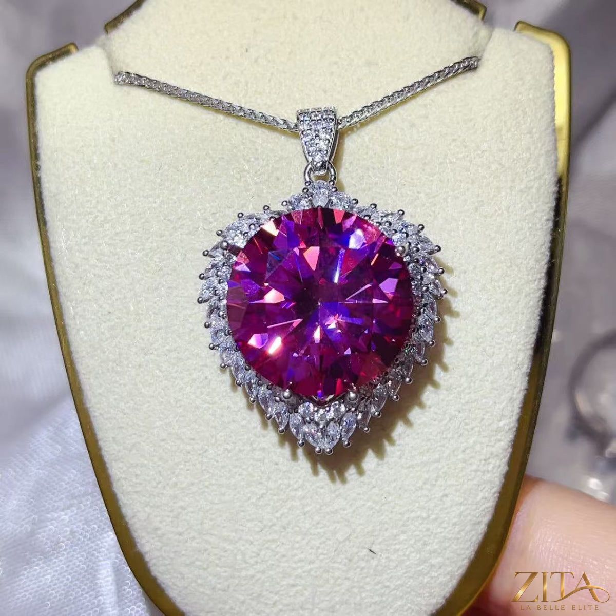 Sterling silver pendant necklace with a 20-carat moissanite gemstone, featuring a sleek and elegant design.