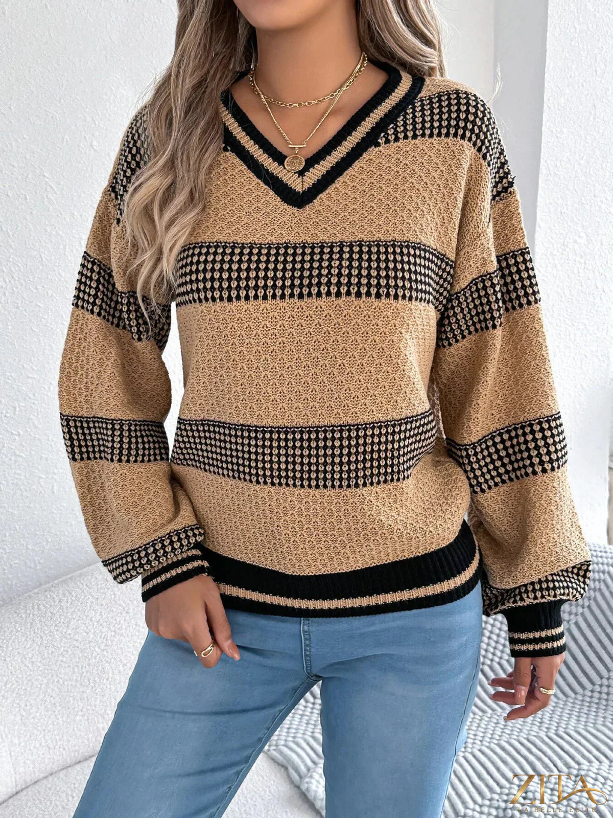 Contrast striped V-neck sweater from Trendsi featuring bold black and white horizontal stripes and a comfortable fit.
