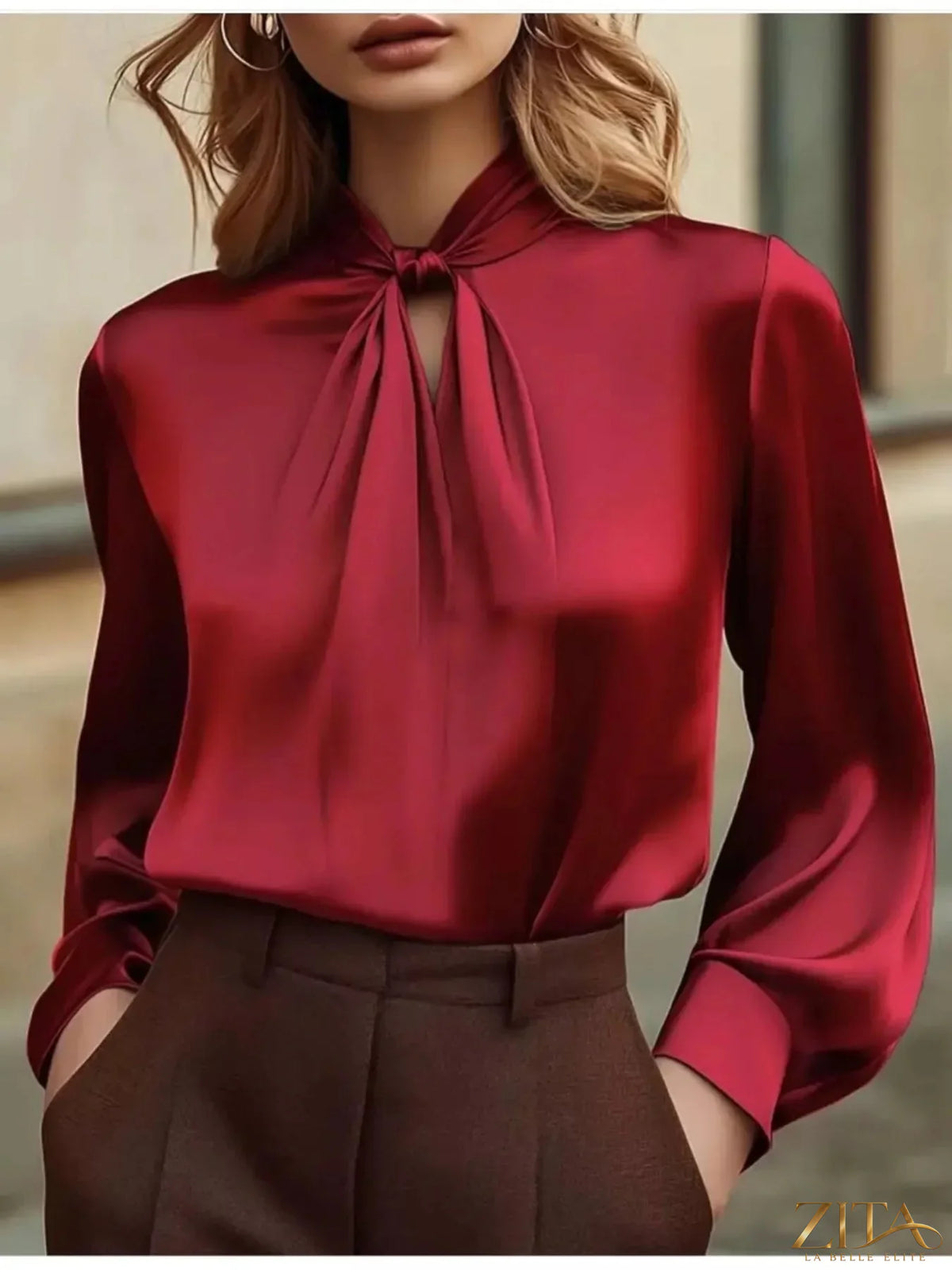 Zita La Belle Elite satin cutout front blouse featuring a stylish design and elegant fit, displayed on a model.