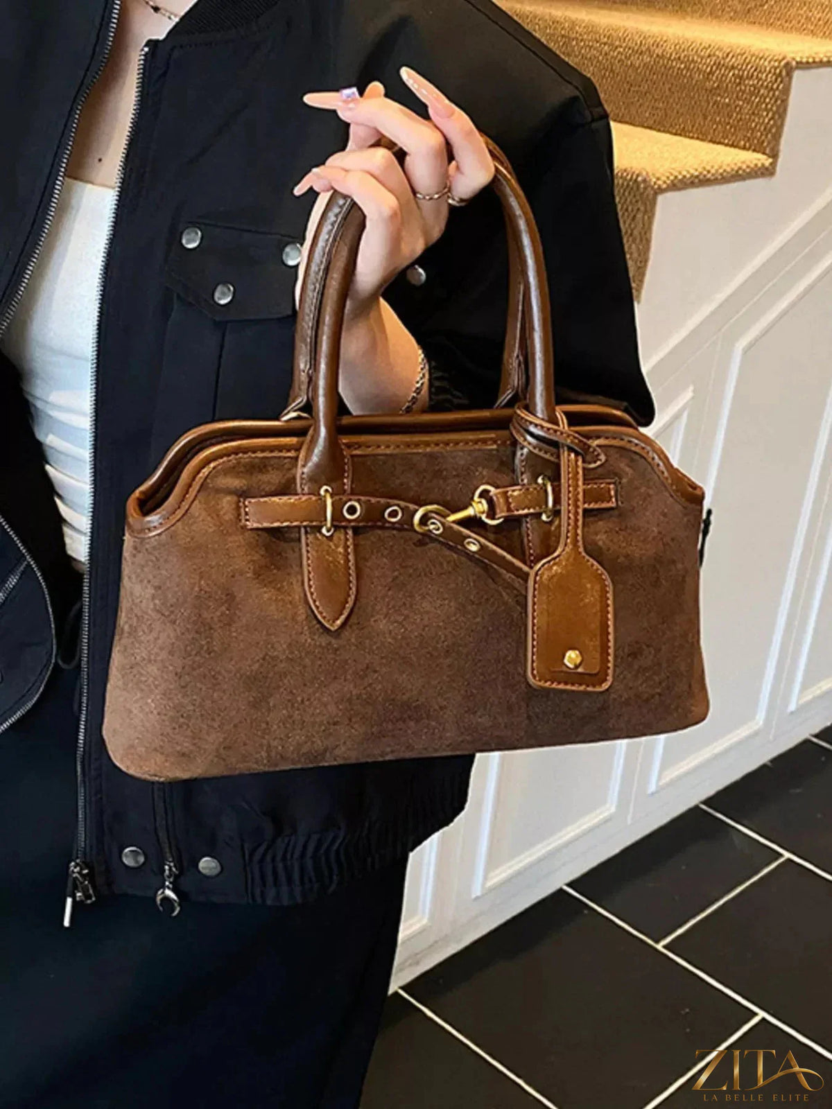 Vintage Zita La Belle Elite handbag with buckle detail, featuring a classic design and elegant leather finish.