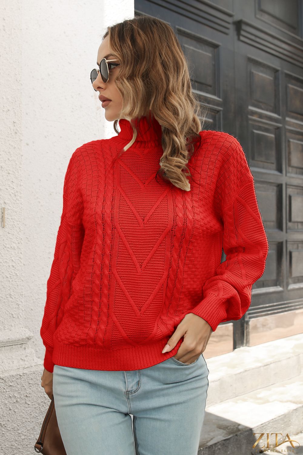 Zita La Belle Elite cable-knit turtleneck sweater in neutral color, featuring a cozy, textured knit design and high turtleneck collar.