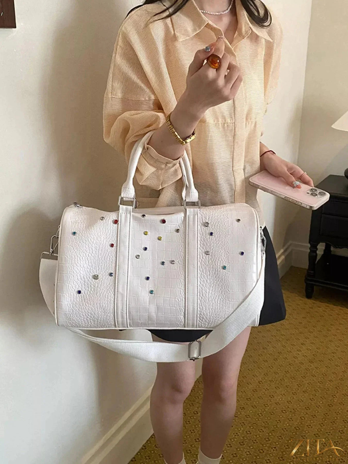 Crocodile embossed studded travel bag by Zita La Belle Elite, featuring textured crocodile pattern and metal stud accents.