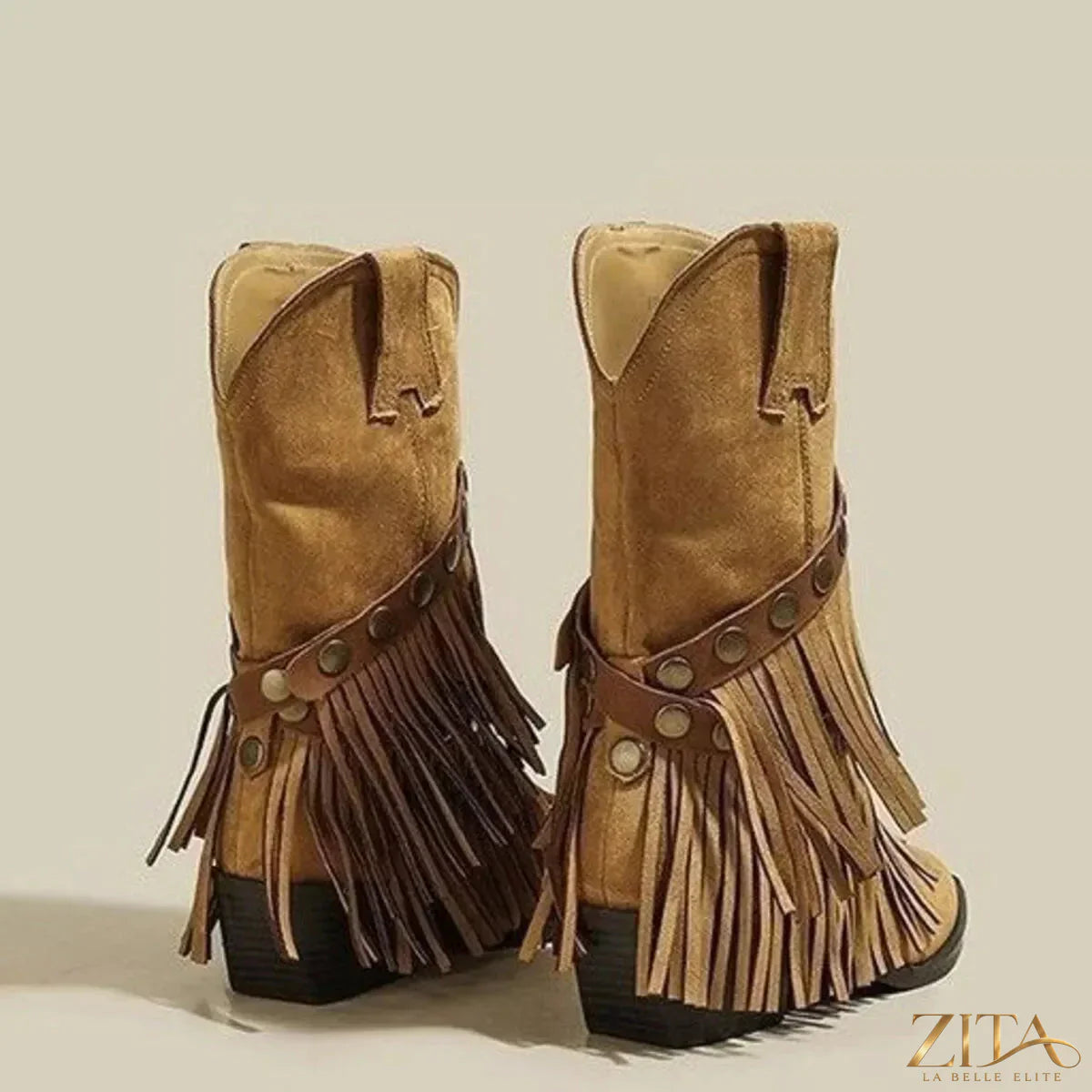 Vintage Zita La Belle Elite suede western fringe boots with studded straps, showcasing detailed fringe and strap embellishments.