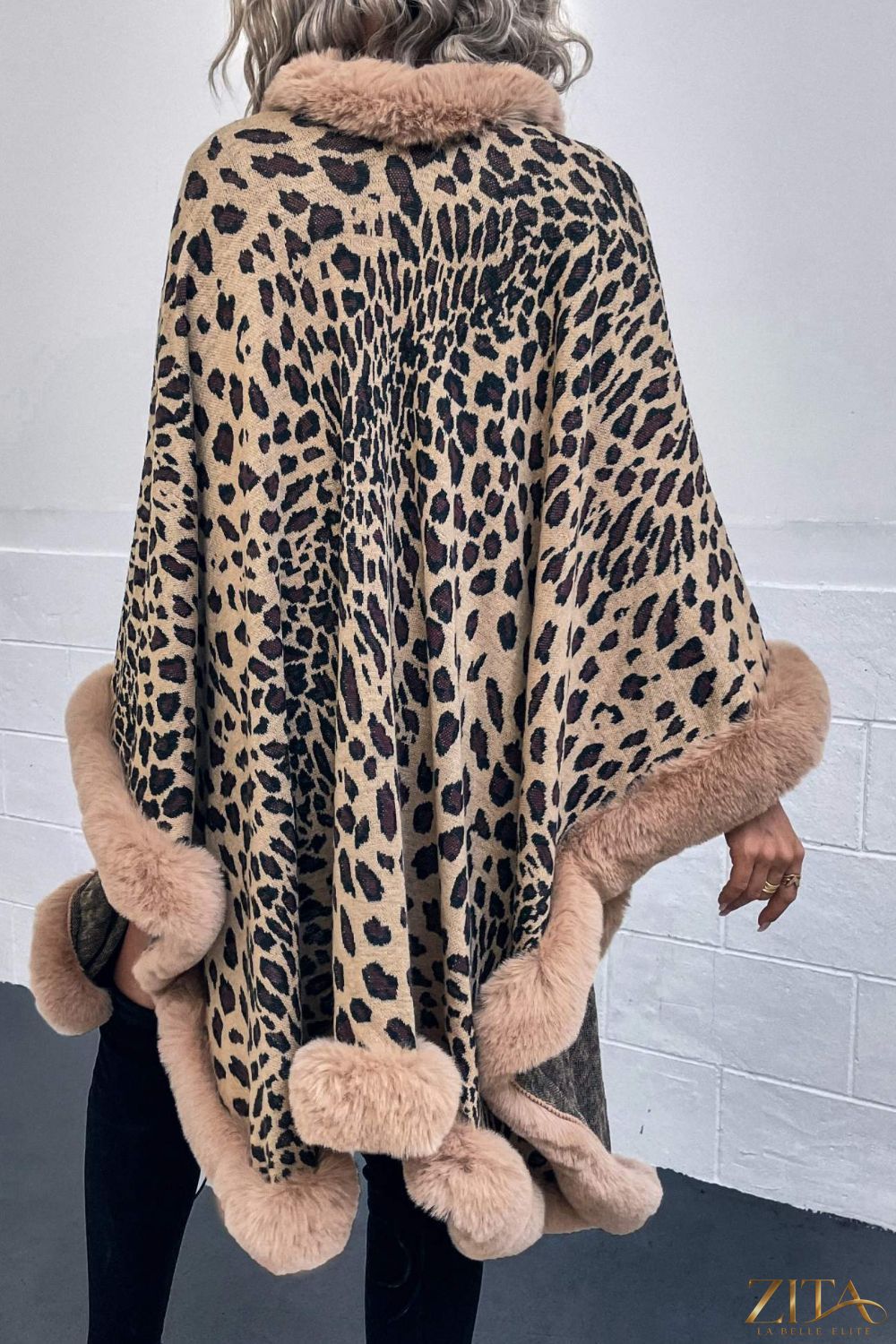 Leopard open front poncho from Trendsi featuring a bold animal print and flowing fabric for a stylish layered look.