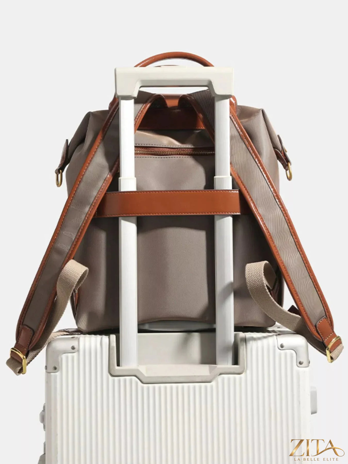Leather trim backpack bag by Trendsi featuring a sleek design, adjustable straps, and spacious interior for daily use.