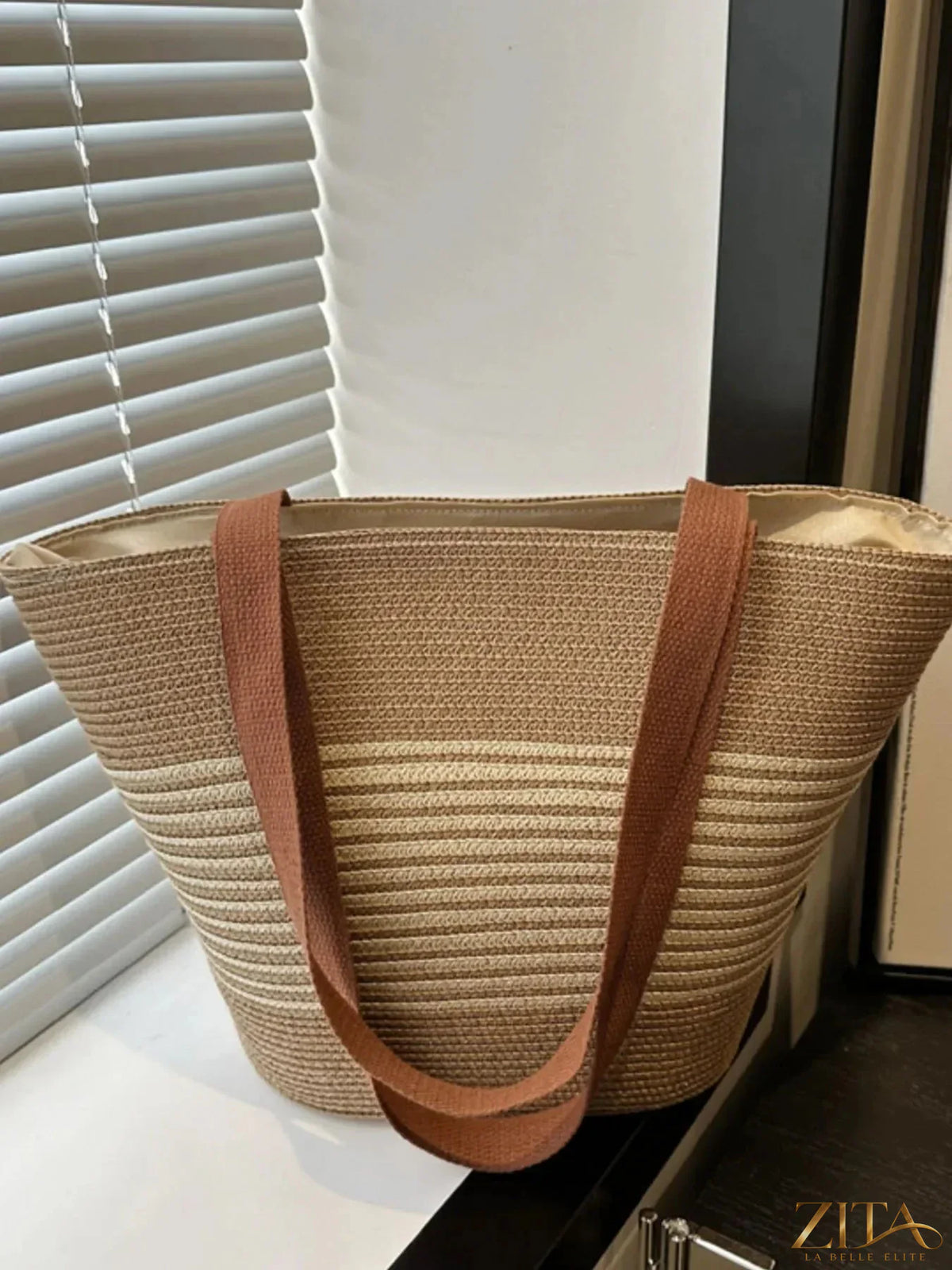 Striped woven tote bag by Zita La Belle Elite featuring blue and white stripes, sturdy handles, and spacious interior for everyday use.