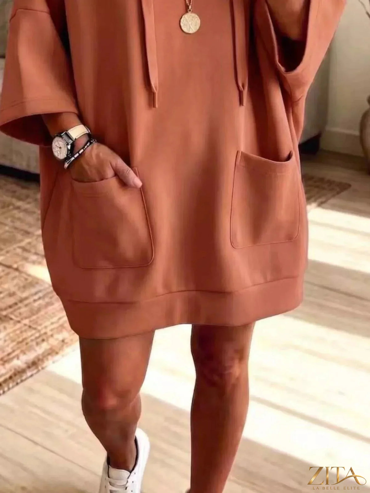 Plus size oversized drawstring hoodie with front pockets from Zita La Belle Elite, featuring a relaxed fit and cozy style.
