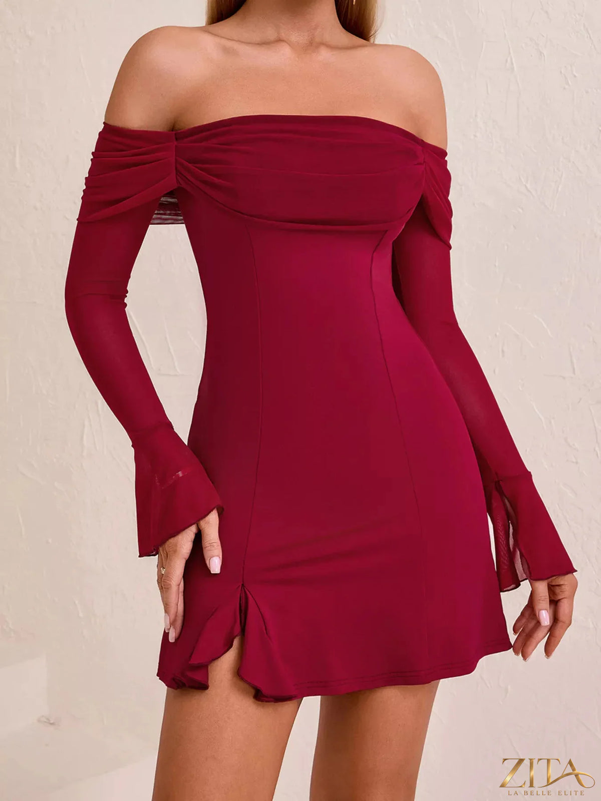 Off-shoulder long sleeve mini dress by Trendsi with a fitted silhouette and stylish design, shown on a model.