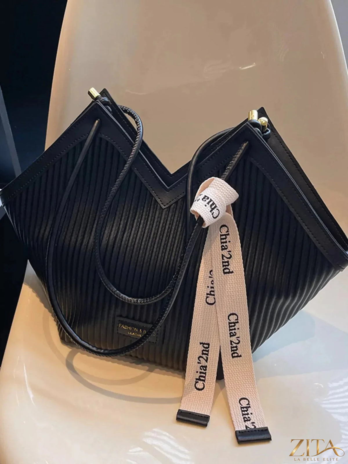 Zita La Belle Elite textured leather shoulder bag with a sleek design and top handle, showcasing its stylish craftsmanship.