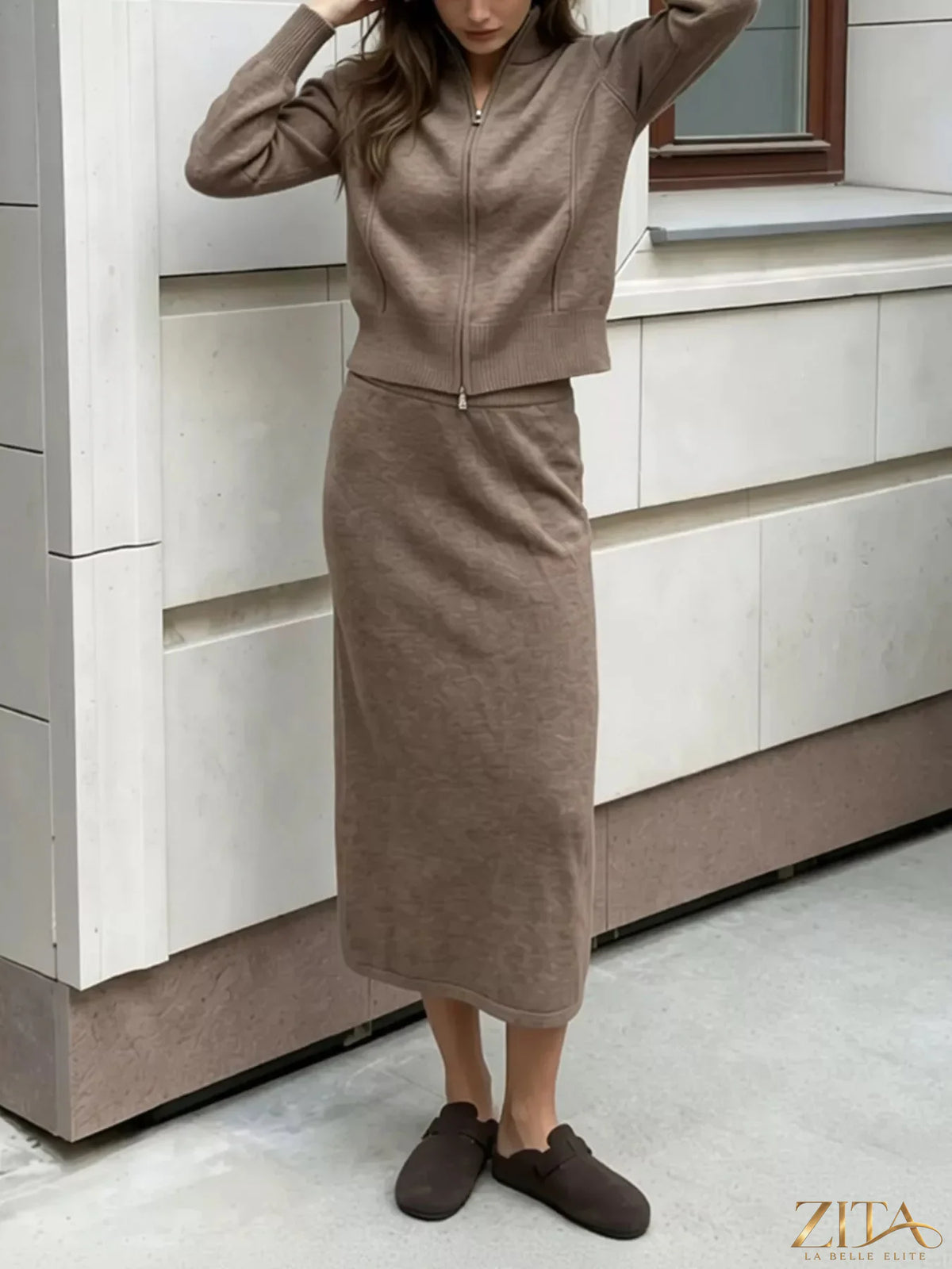 Zita La Belle Elite zip-up mock neck cardigan and matching midi skirt sweater set, featuring a coordinated knit design and neutral tones.