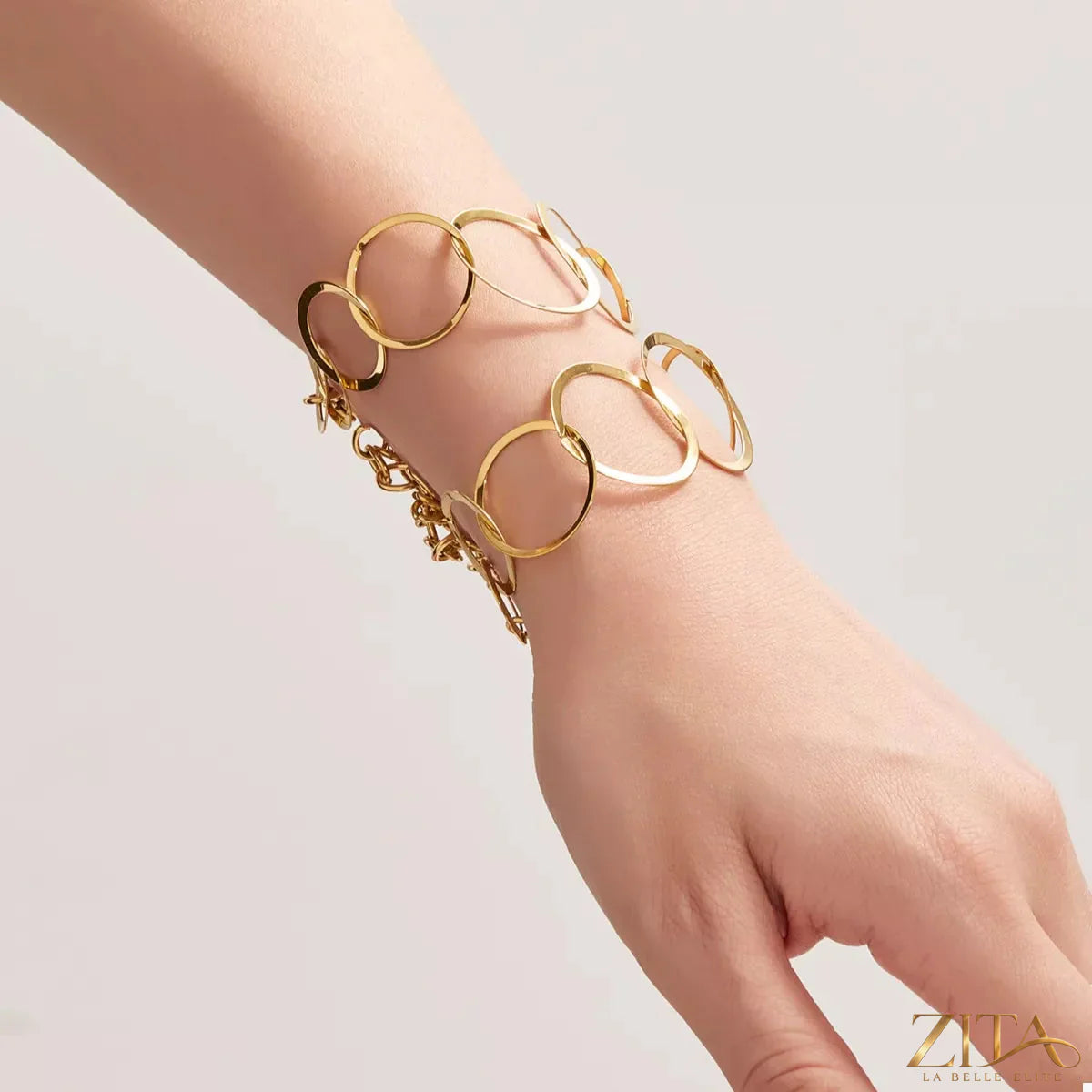 18K gold-plated titanium steel round bracelet by Zita La Belle Elite, featuring polished circular links for elegant style.