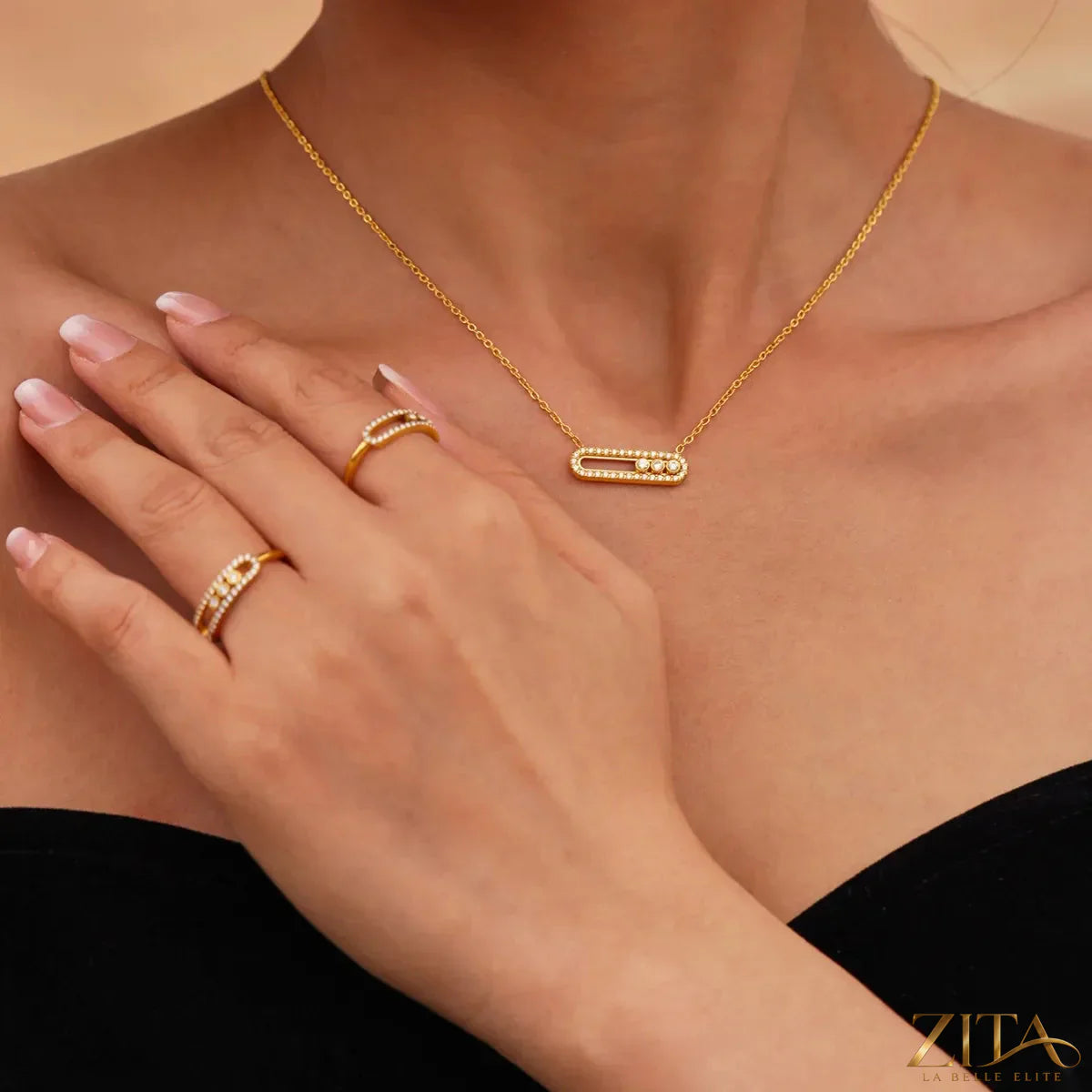 Moving crystal bar necklace and ring jewelry set featuring sparkling stones, elegant silver-tone design, perfect for stylish accessories.