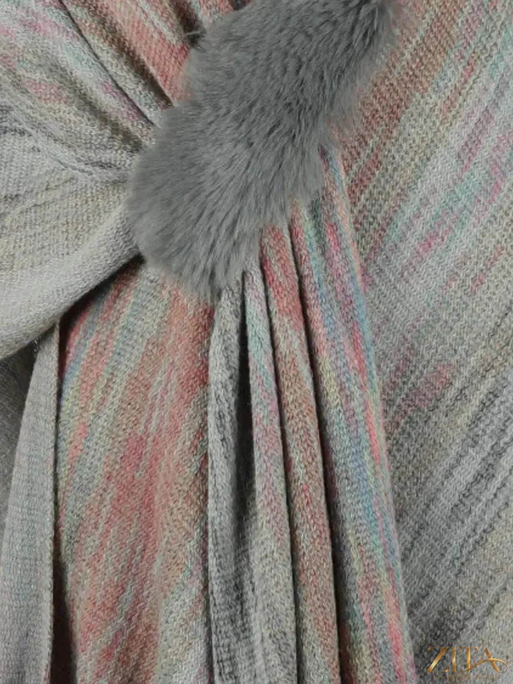 Heathered fringe hem poncho by Trendsi featuring a cozy, stylish knit with fringe details and a relaxed fit.