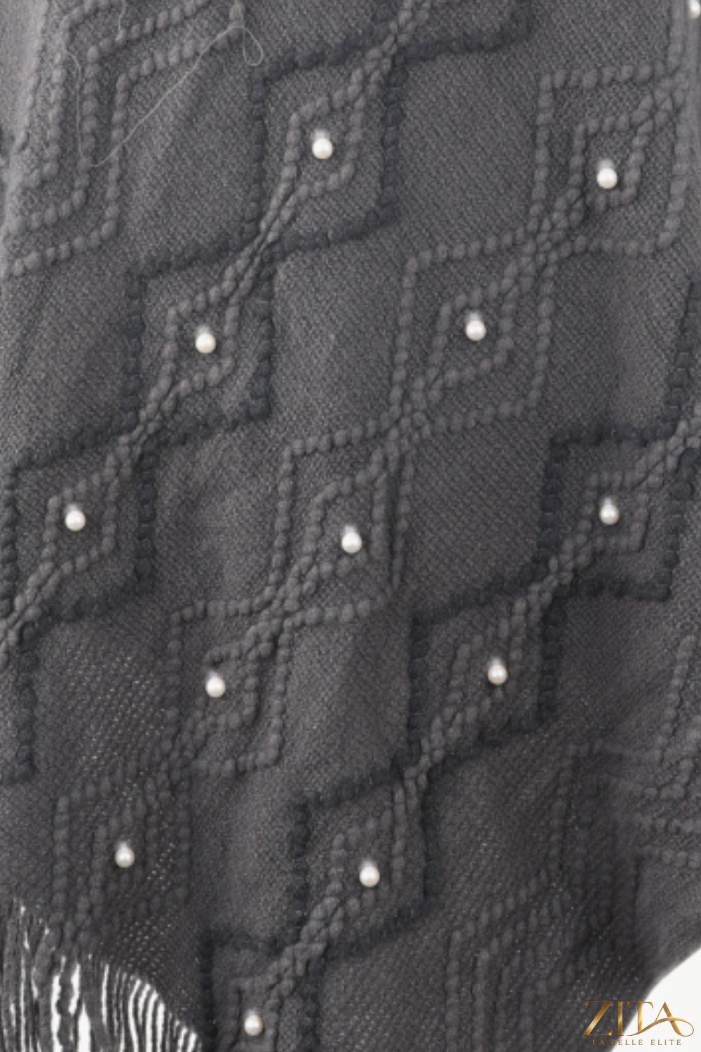 Pearl trim v-neck fringed hem poncho from Trendsi, showcasing a flowy design with elegant pearl accents and a stylish V-neck.