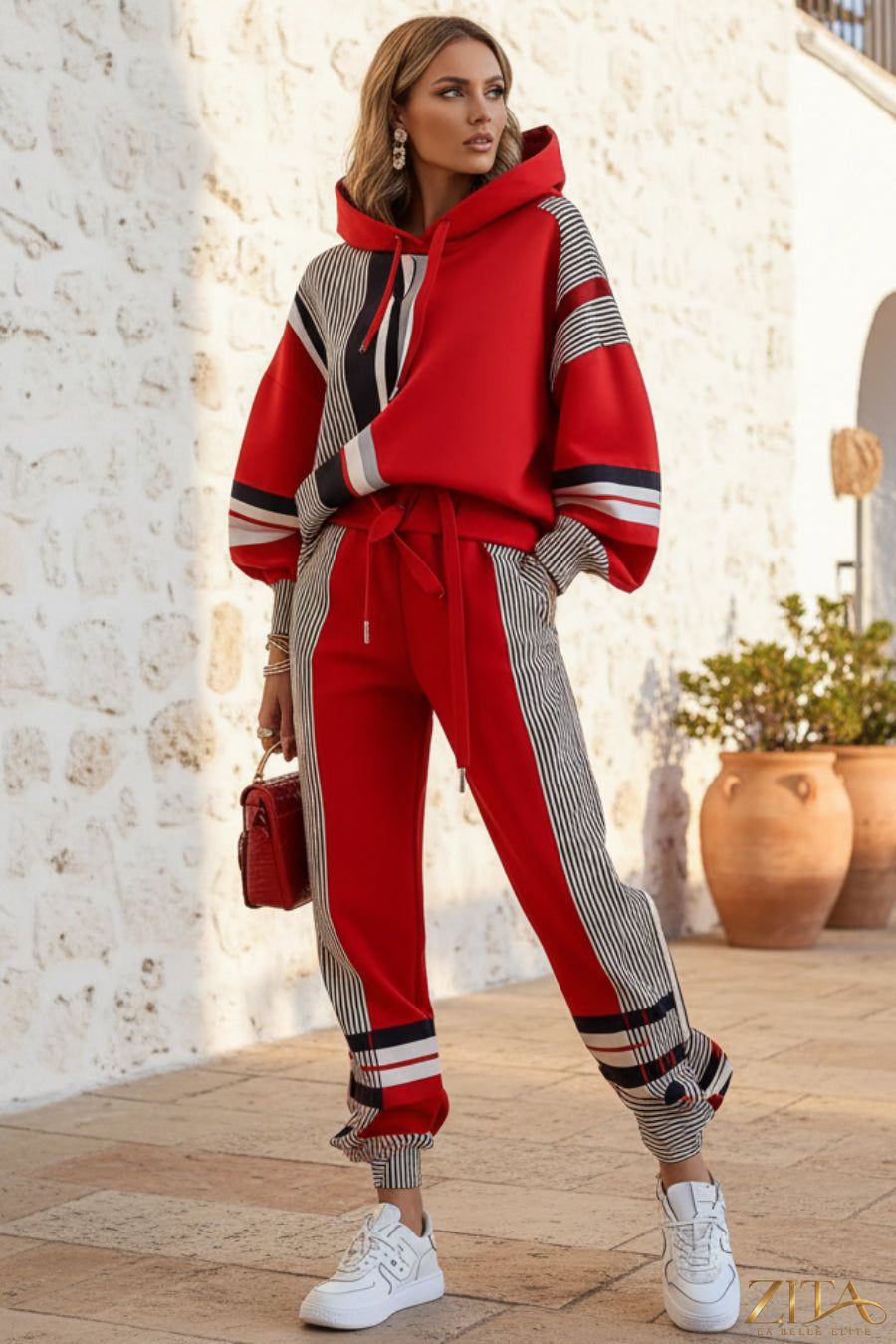 Color-block stripe-panel hoodie and jogger set by Zita La Belle Elite, featuring vibrant color accents and comfortable casual style.