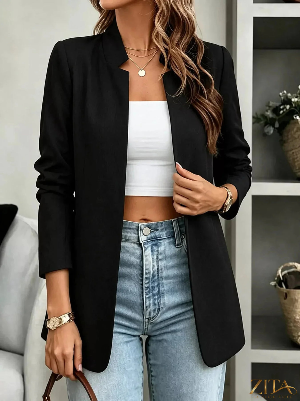 Open-front long sleeve blazer by Trendsi, shown in a stylish, tailored design with a sleek lapel and neutral color.
