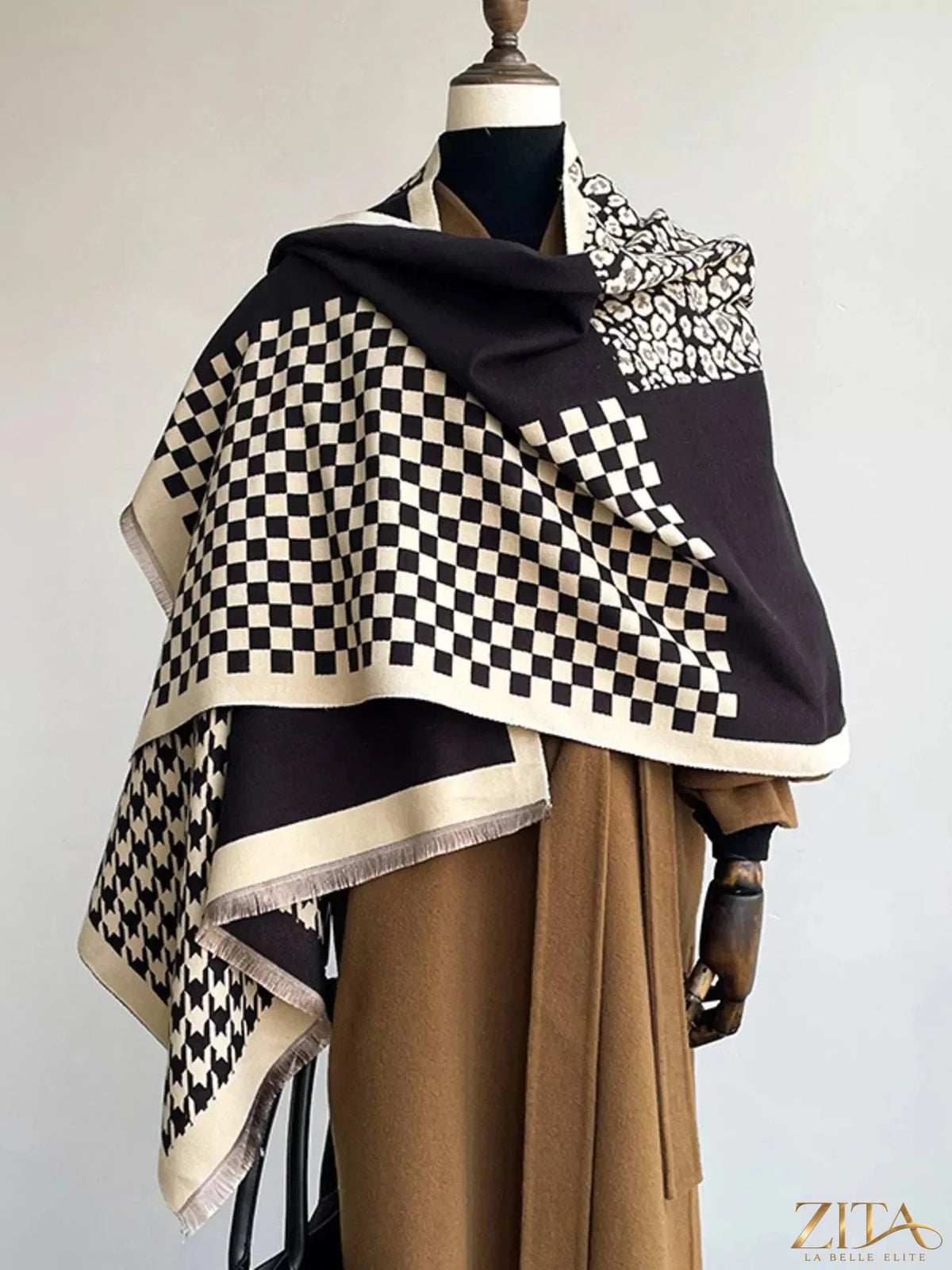 Checkered raw hem scarf by Zita La Belle Elite featuring a stylish black and white pattern with frayed edges.