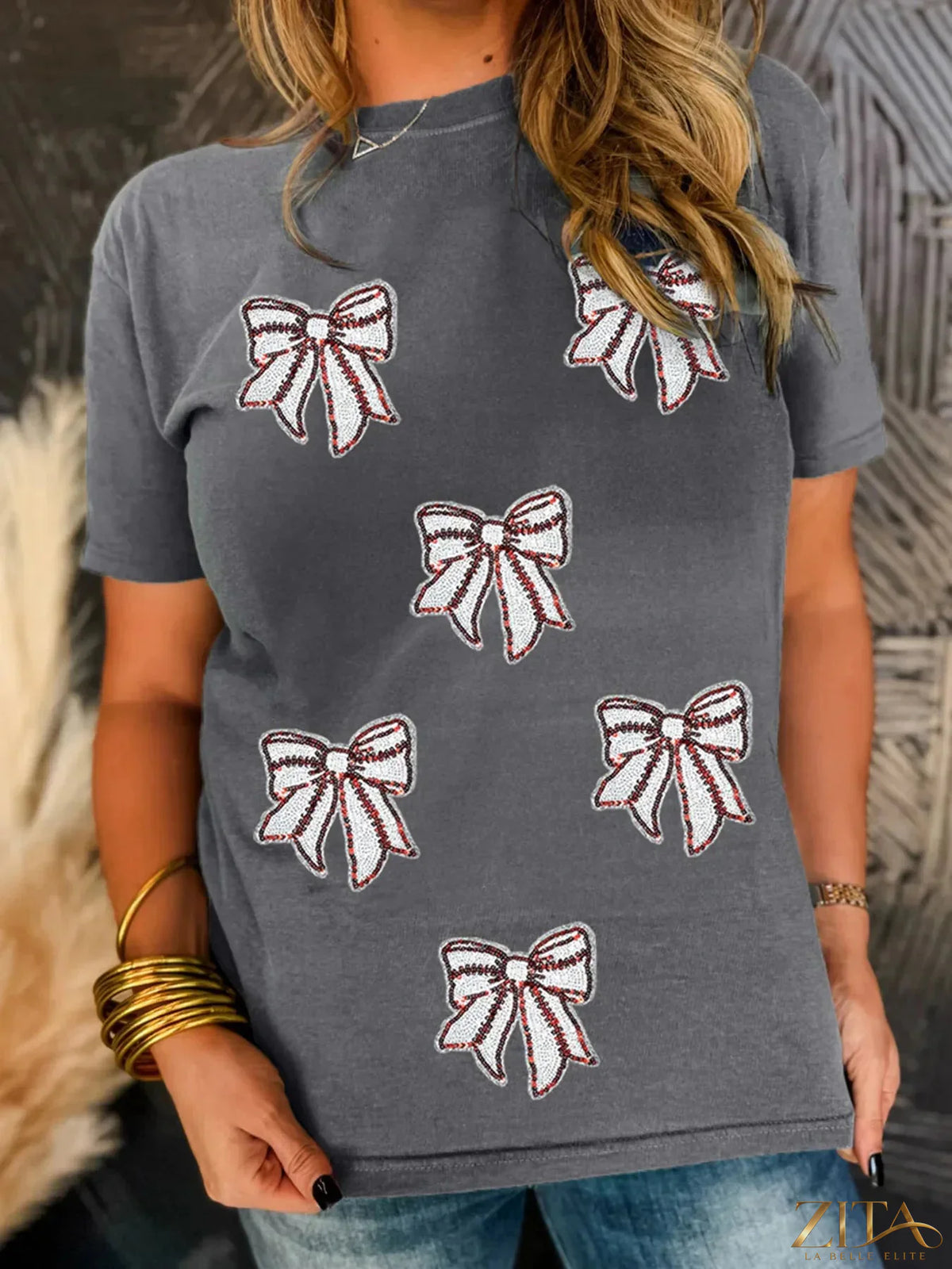 Sequin bow short sleeve T-shirt by Trendsi featuring a sparkly bow detail on the front, casual and stylish for everyday wear.
