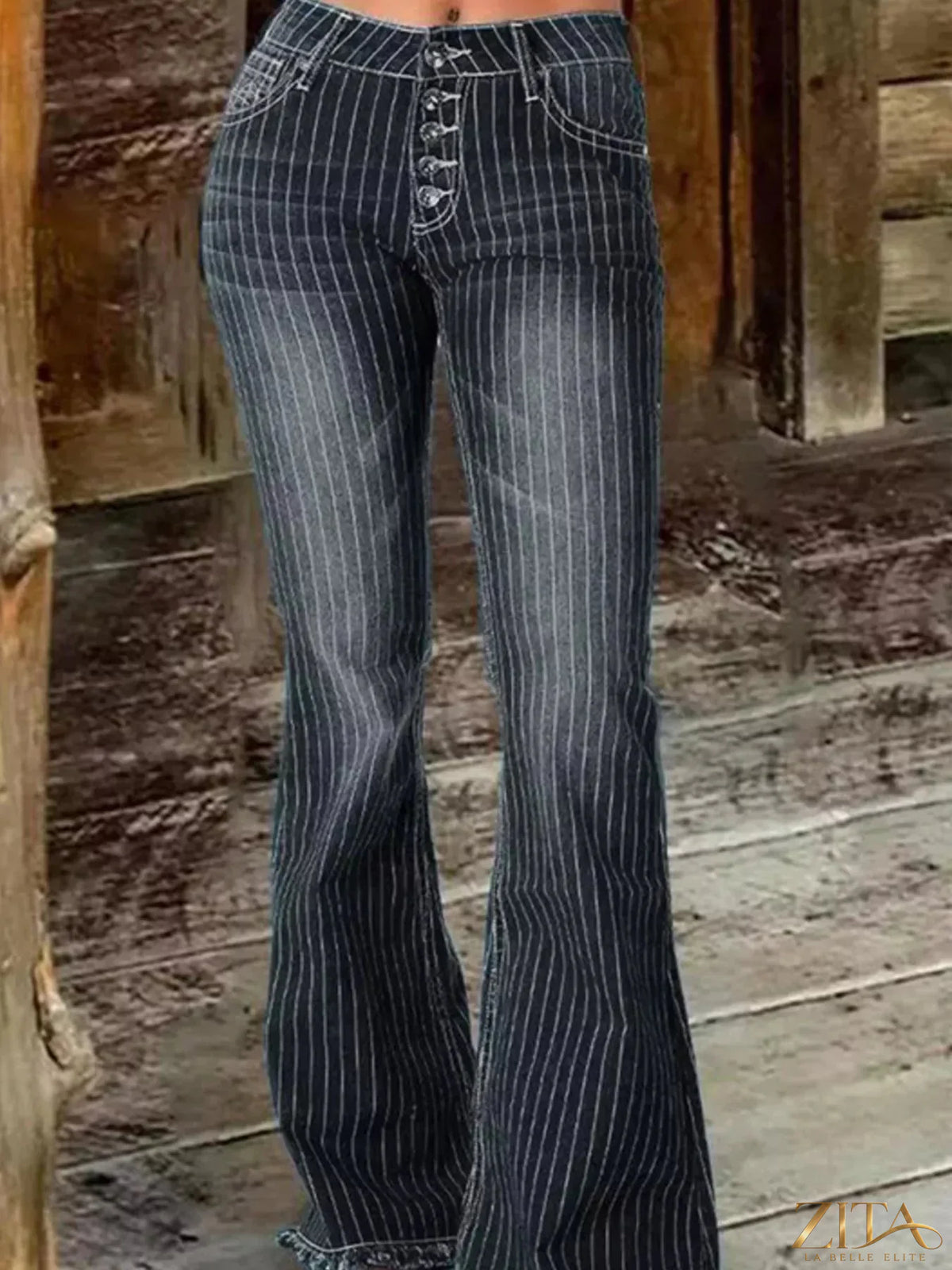 Zita La Belle Elite striped button fly flare jeans with high waist and vibrant vertical stripes, styled with casual footwear.