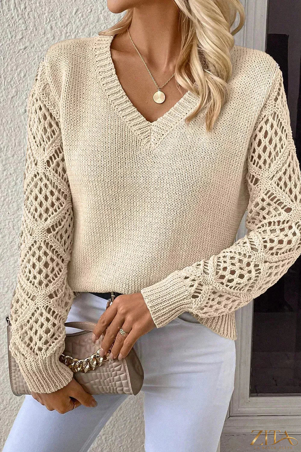 Zita La Belle Elite V-neck crochet sleeve sweater featuring a soft knit fabric with stylish crochet detailing on sleeves.