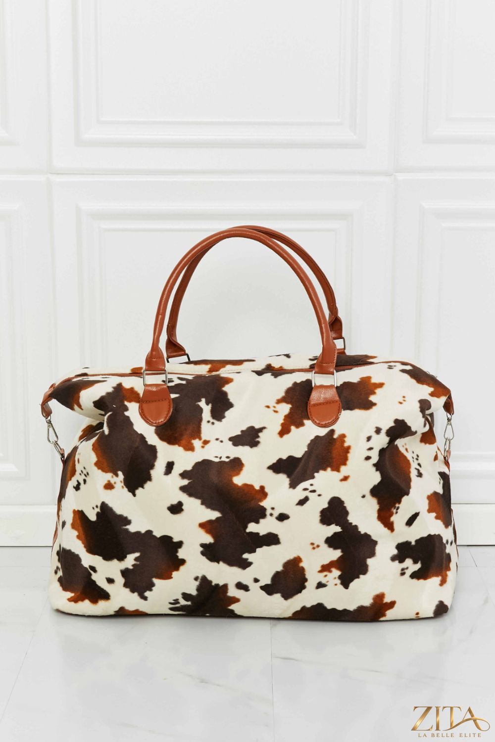 Animal print plush weekender bag by Zita La Belle Elite featuring a stylish, soft fabric with sturdy handles and spacious interior.
