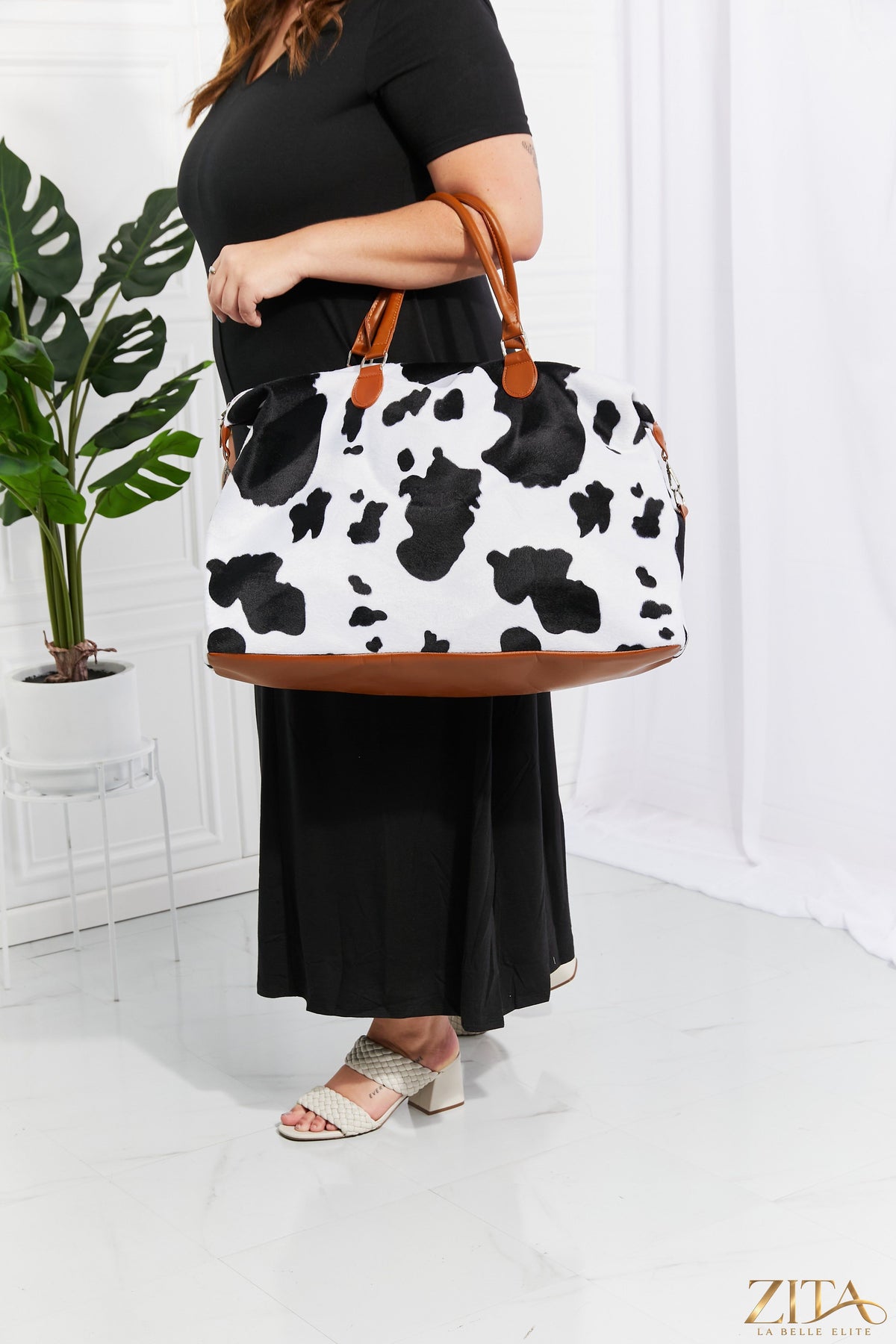 Zita La Belle Elite animal print plush weekender bag with zipper closure and handle for travel or weekend use.
