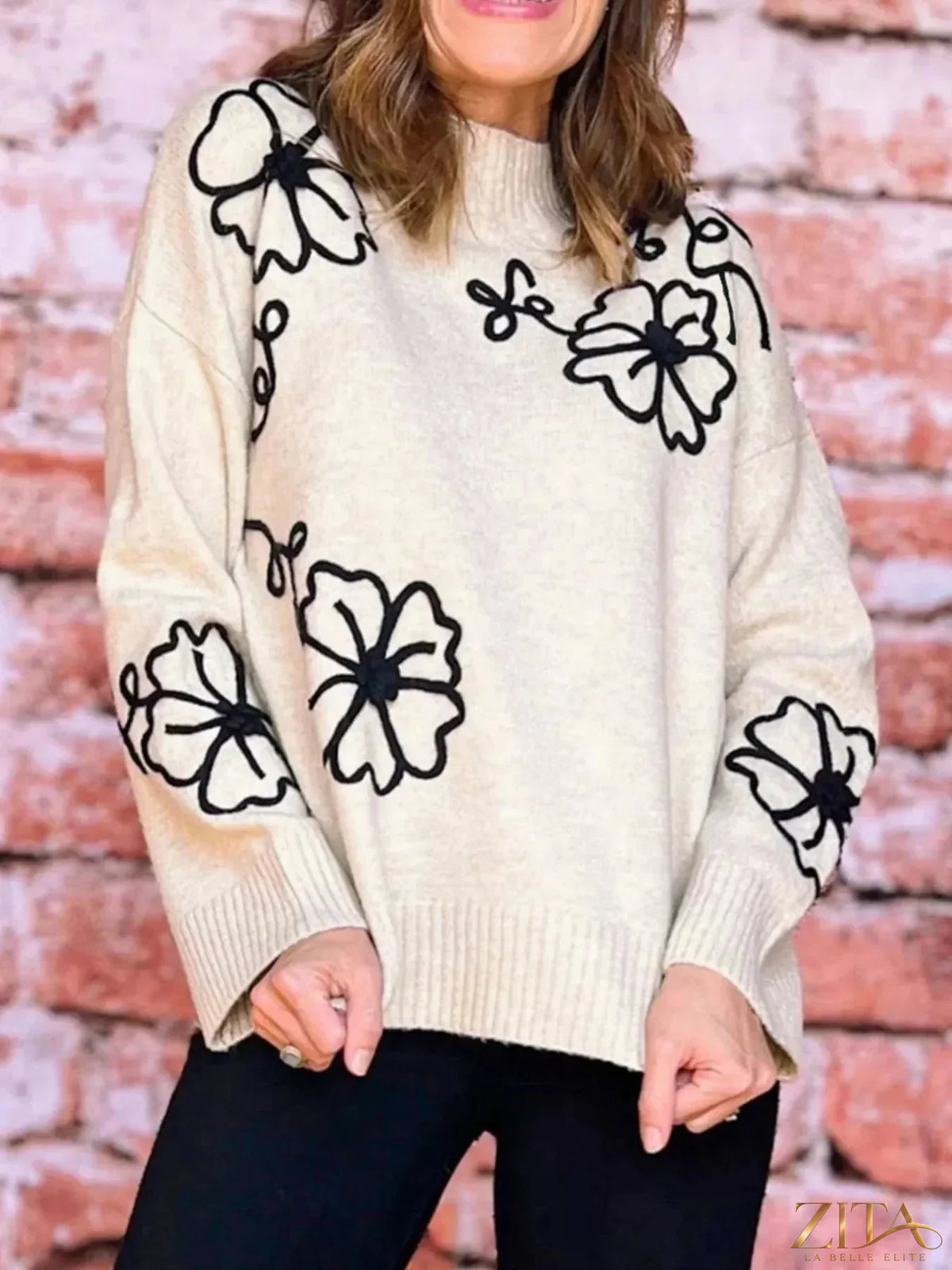 Zita La Belle Elite flower stitching mock neck sweater in soft knit with floral embroidery, close-up of detailed design.
