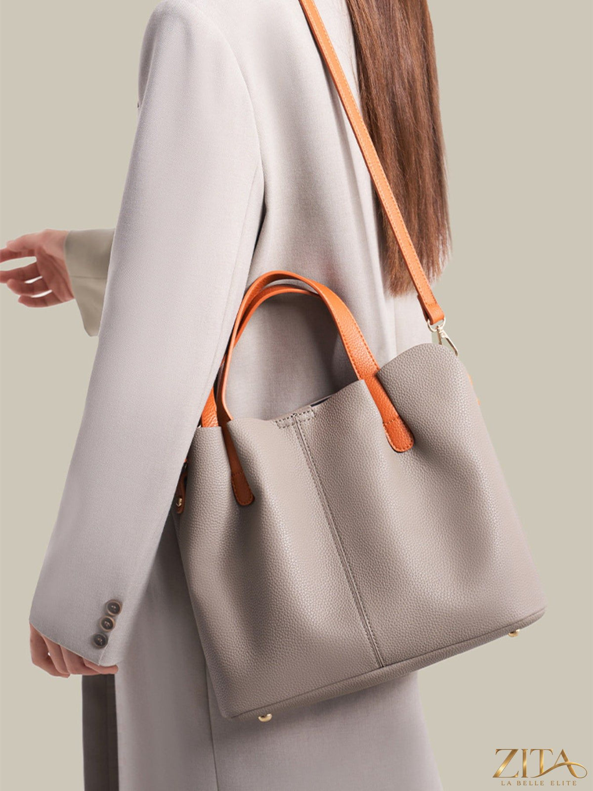 Leather contrast handle handbag with stylish design, featuring a sleek leather body and contrasting handle accents.