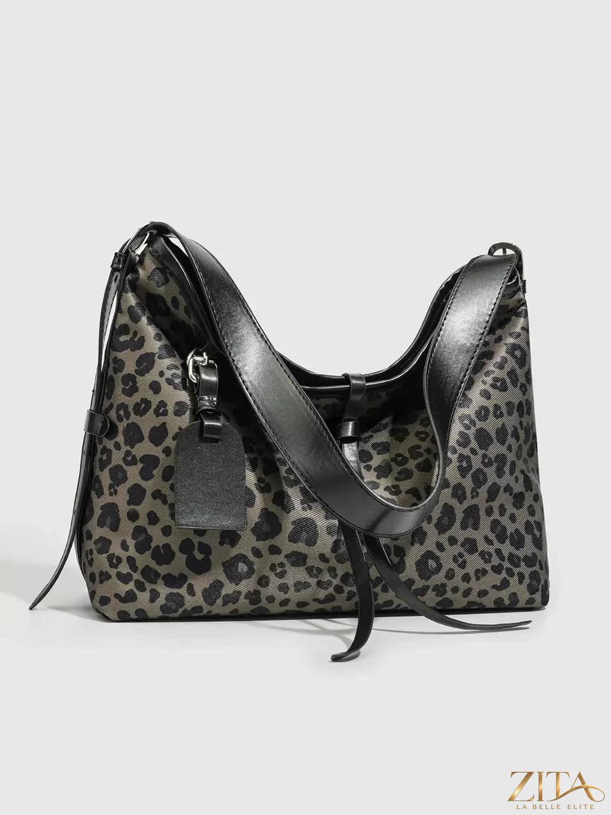 Leopard print Zita La Belle Elite hobo shoulder bag with curved shape and adjustable strap, showcasing stylish leopard pattern.