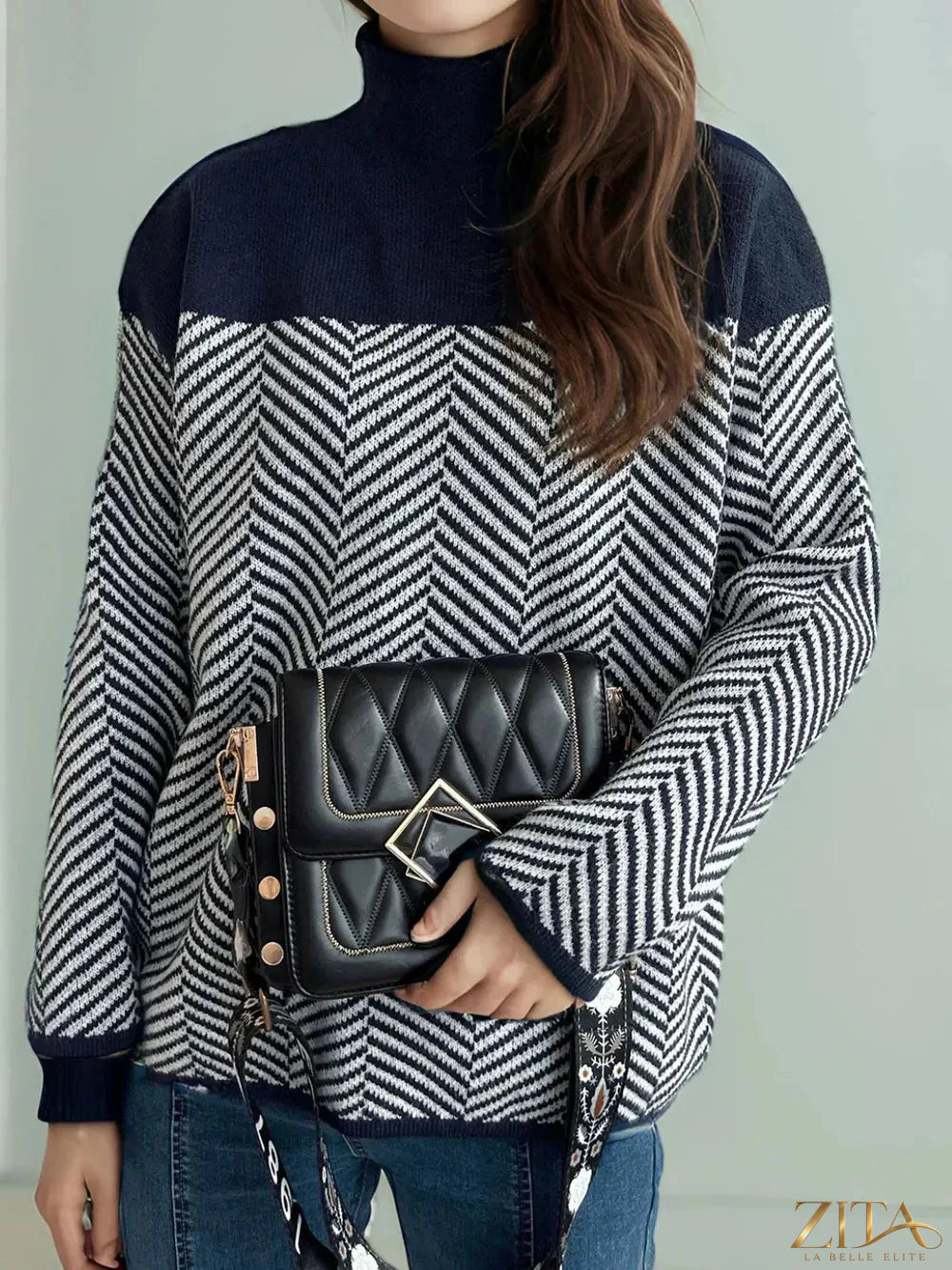 Contrast turtleneck long sleeve sweater by Trendsi, featuring a cozy design with a stylish color block pattern and ribbed cuffs.