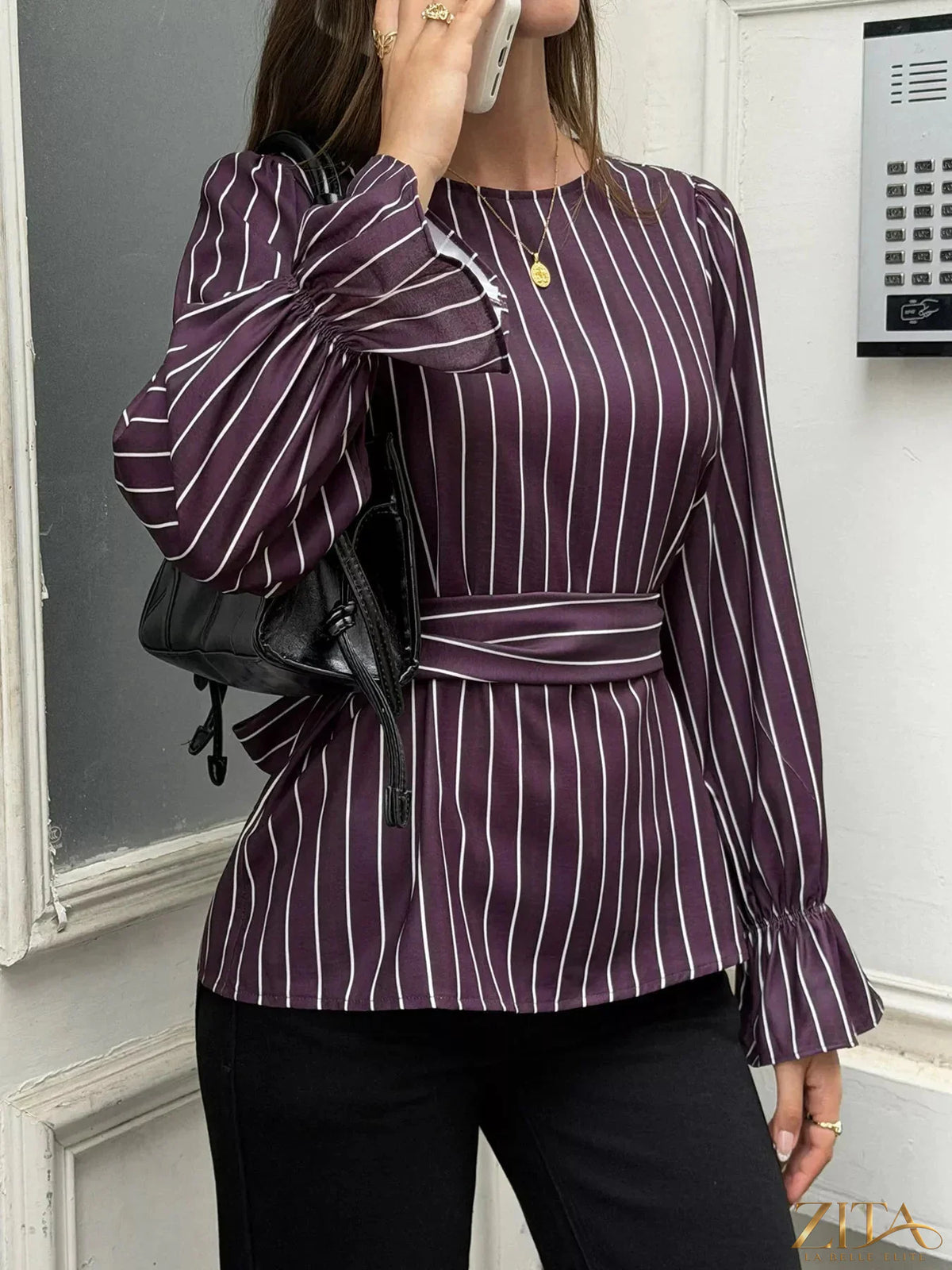 Zita La Belle Elite striped blouse with flounce sleeves, featuring a stylish and feminine design with bold stripe patterns.