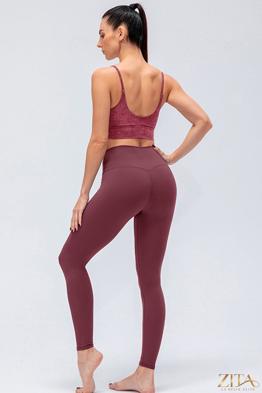 Black wide waistband slim fit active leggings by Trendsi featuring a high-rise waist and stretchy, breathable fabric for workout comfort.