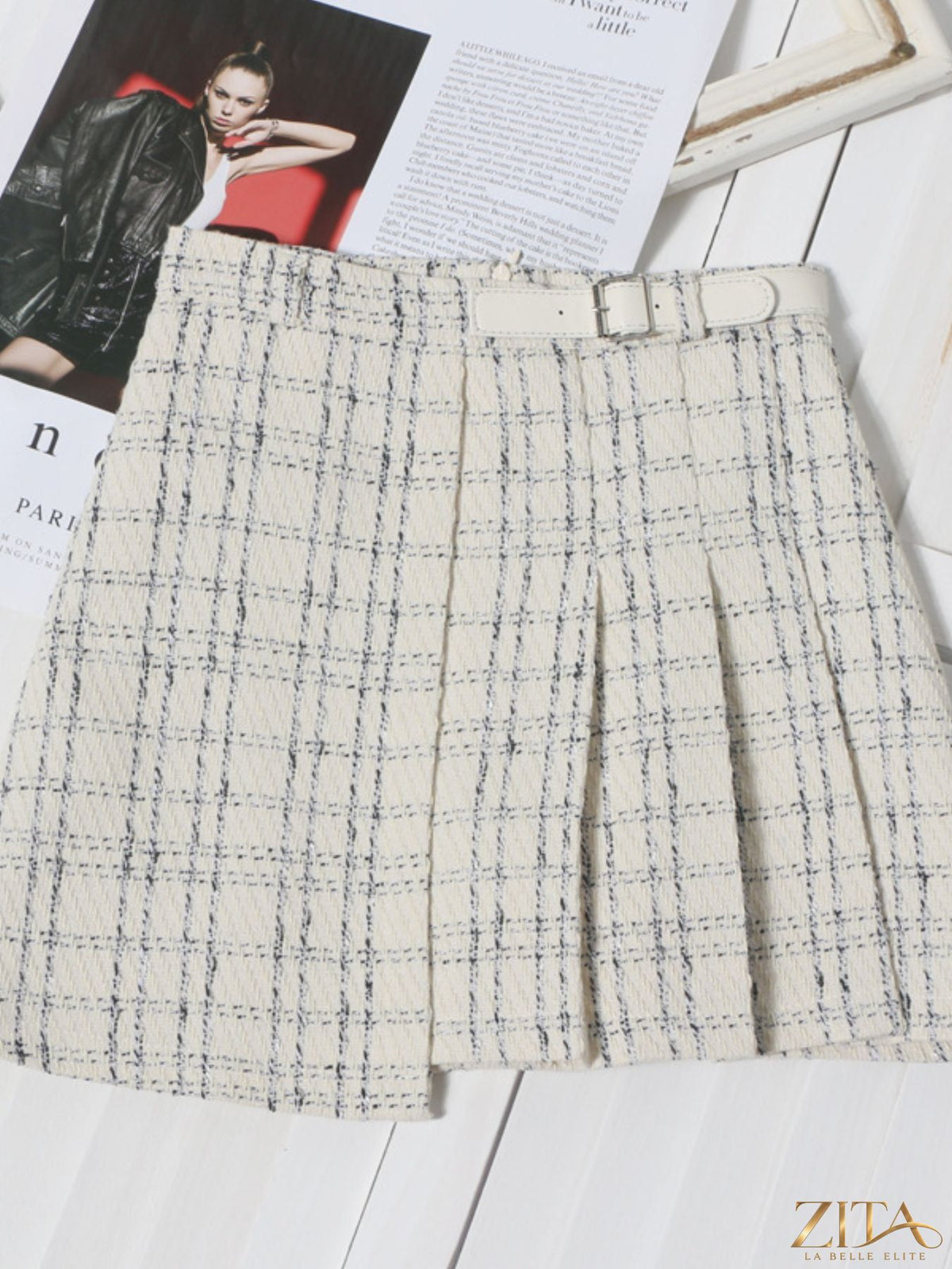 Zita La Belle Elite pleated plaid mini skirt featuring a high-waist design and classic checkered pattern.