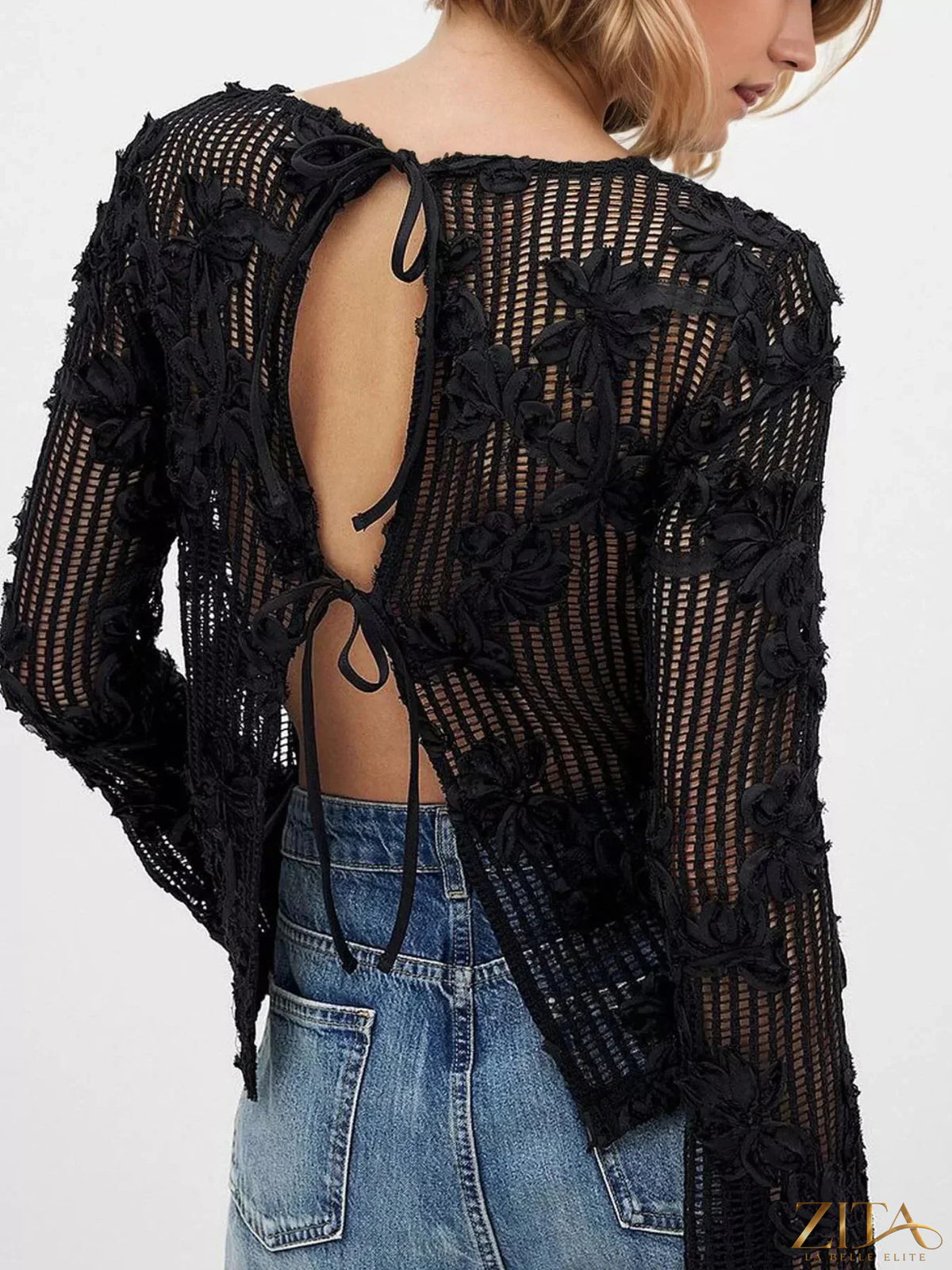 Zita La Belle Elite openwork tied-back long sleeve blouse with intricate lace details and a stylish collar, shown on a model.