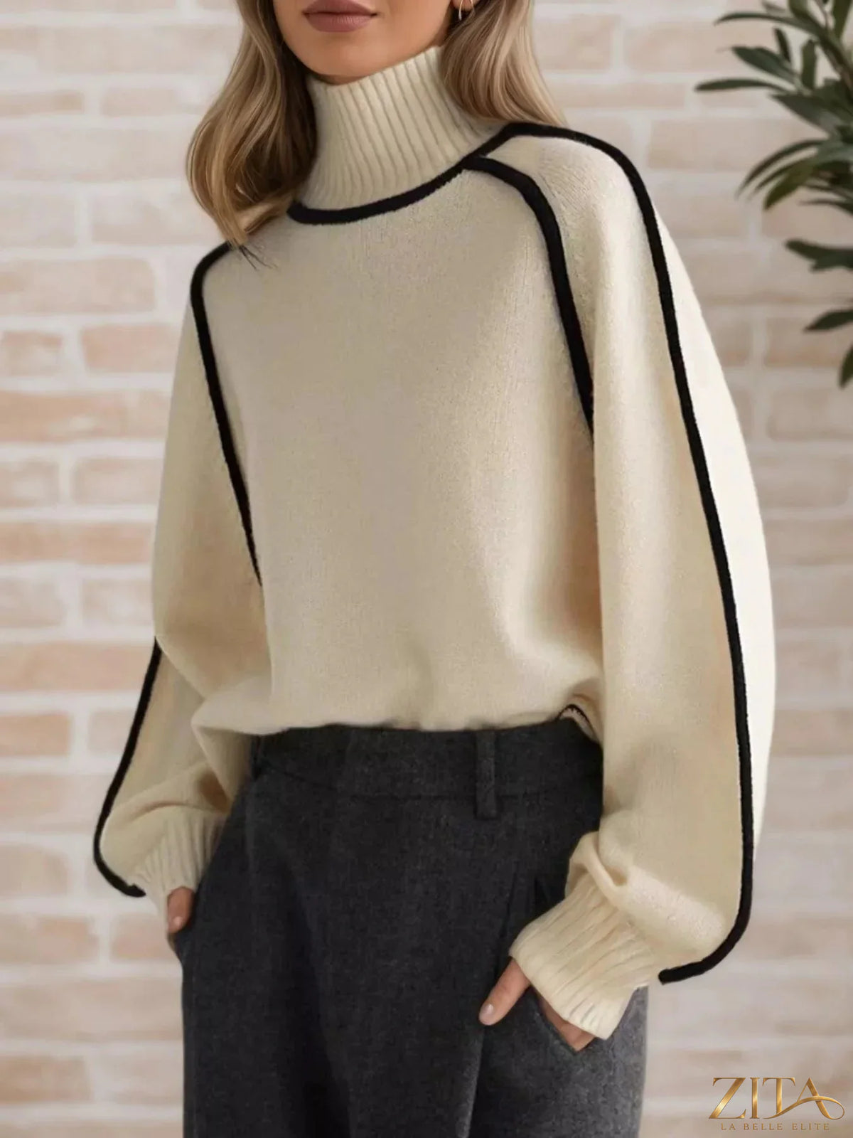 Zita La Belle Elite contrast trim turtleneck sweater in soft knit with black and white color blocking, close-up of the sweater's collar.