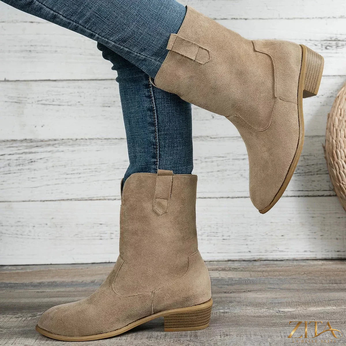 Suede block heel western boots featuring pointed toes and classic Western stitching, stylish and crafted for a western-inspired look.