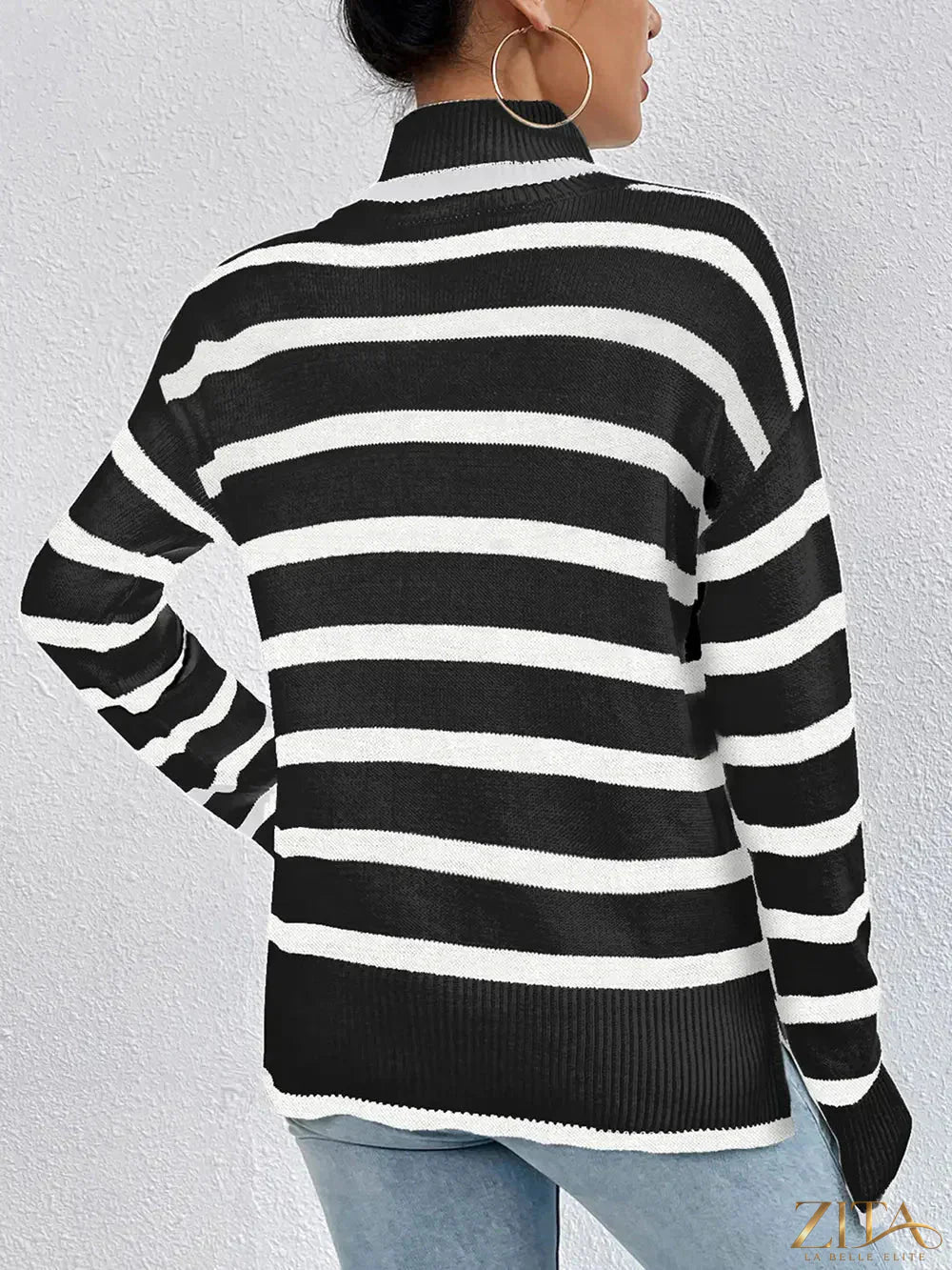 Striped turtleneck long sleeve sweater by Trendsi, showing a cozy, fitted knit with bold horizontal stripes in various colors.