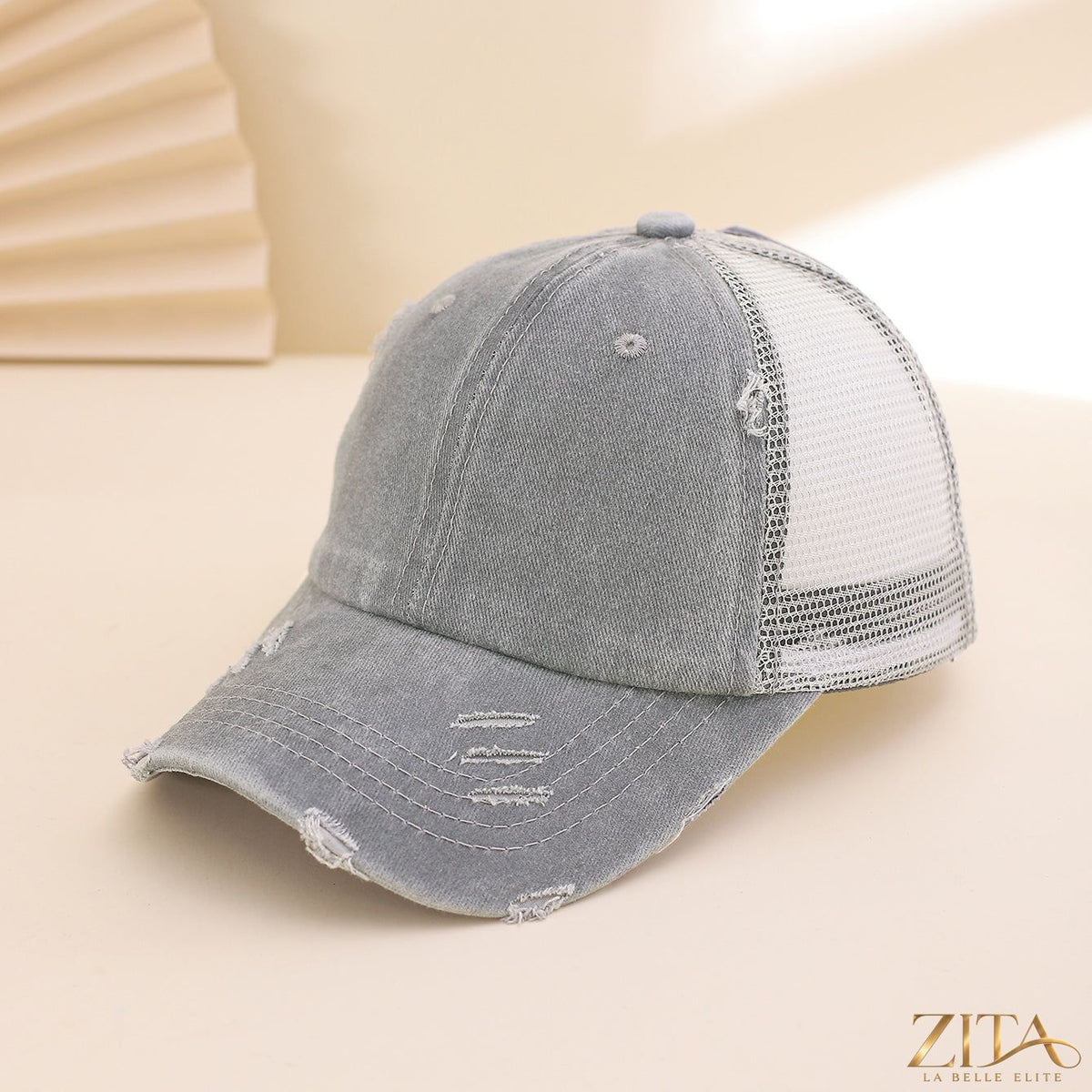 Distressed washed mesh baseball cap by Zita La Belle Elite, casual hat with breathable mesh fabric and faded vintage style.
