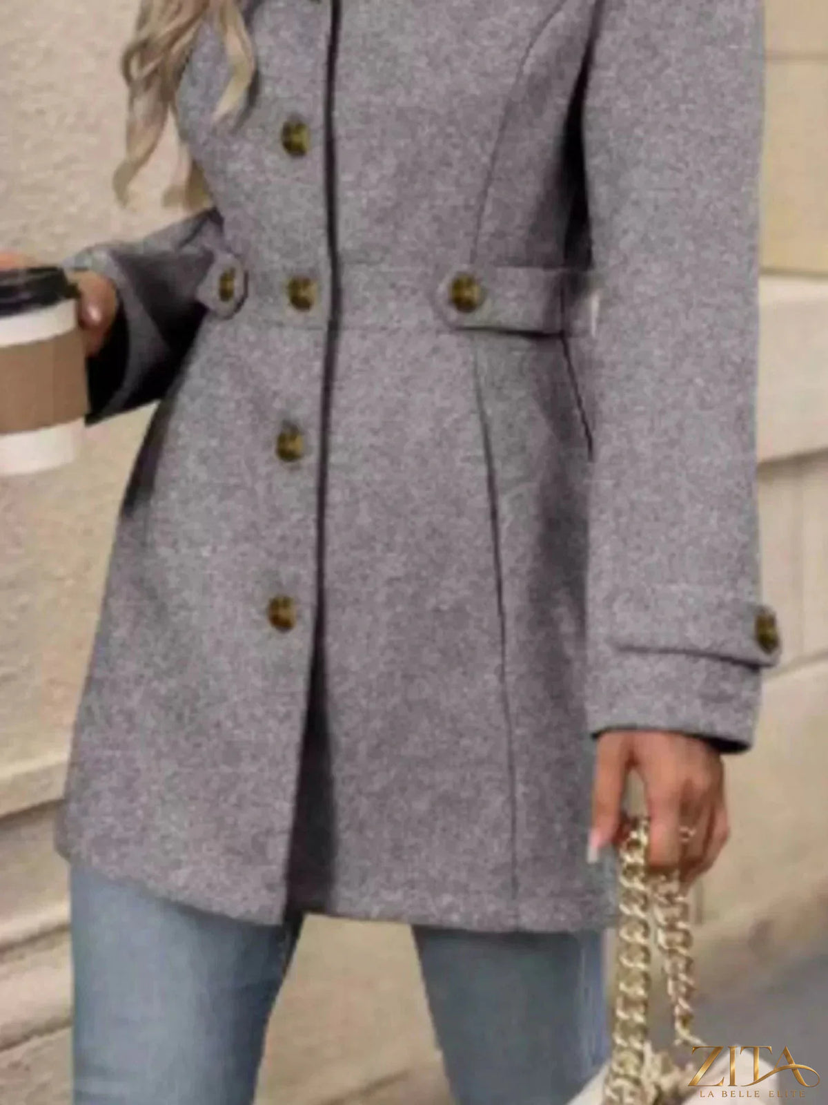 Zita La Belle Elite button-up long sleeve coat in a stylish fabric, shown on a hanger with front view and visible collar details.