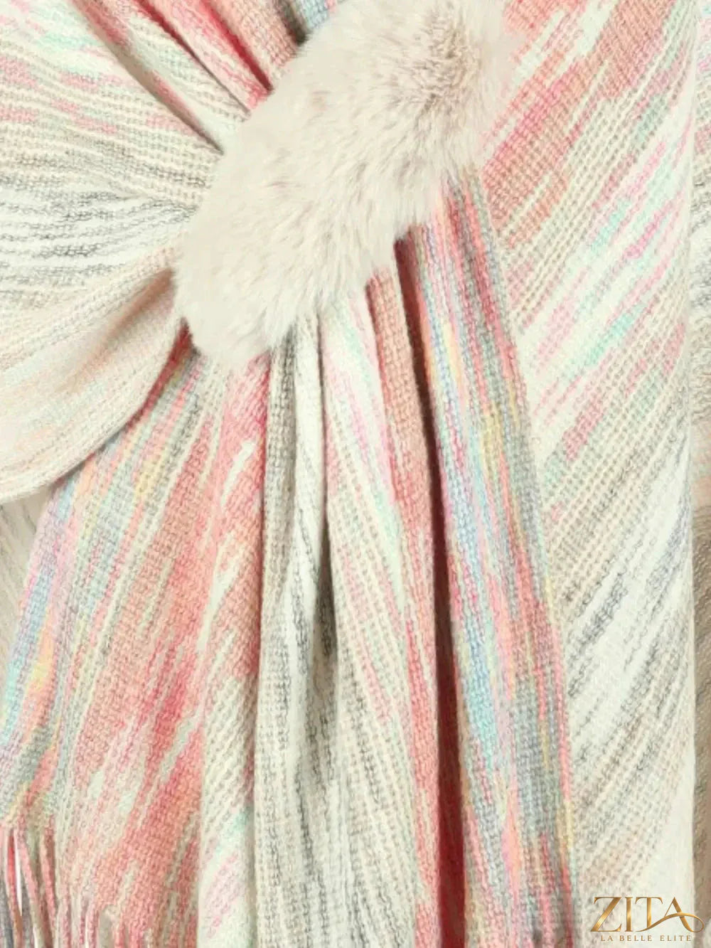 Heathered fringe hem poncho by Trendsi, featuring cozy fabric and stylish design, shown draped with fringe details.