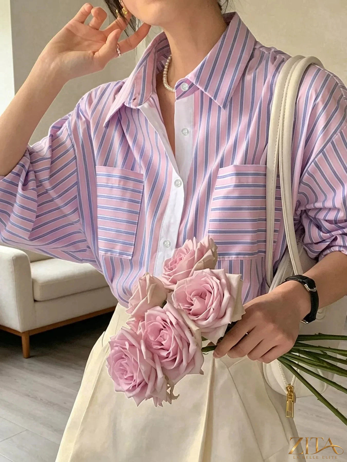 Zita La Belle Elite striped button-down shirt with vertical blue and white stripes, classic collar, and long sleeves.